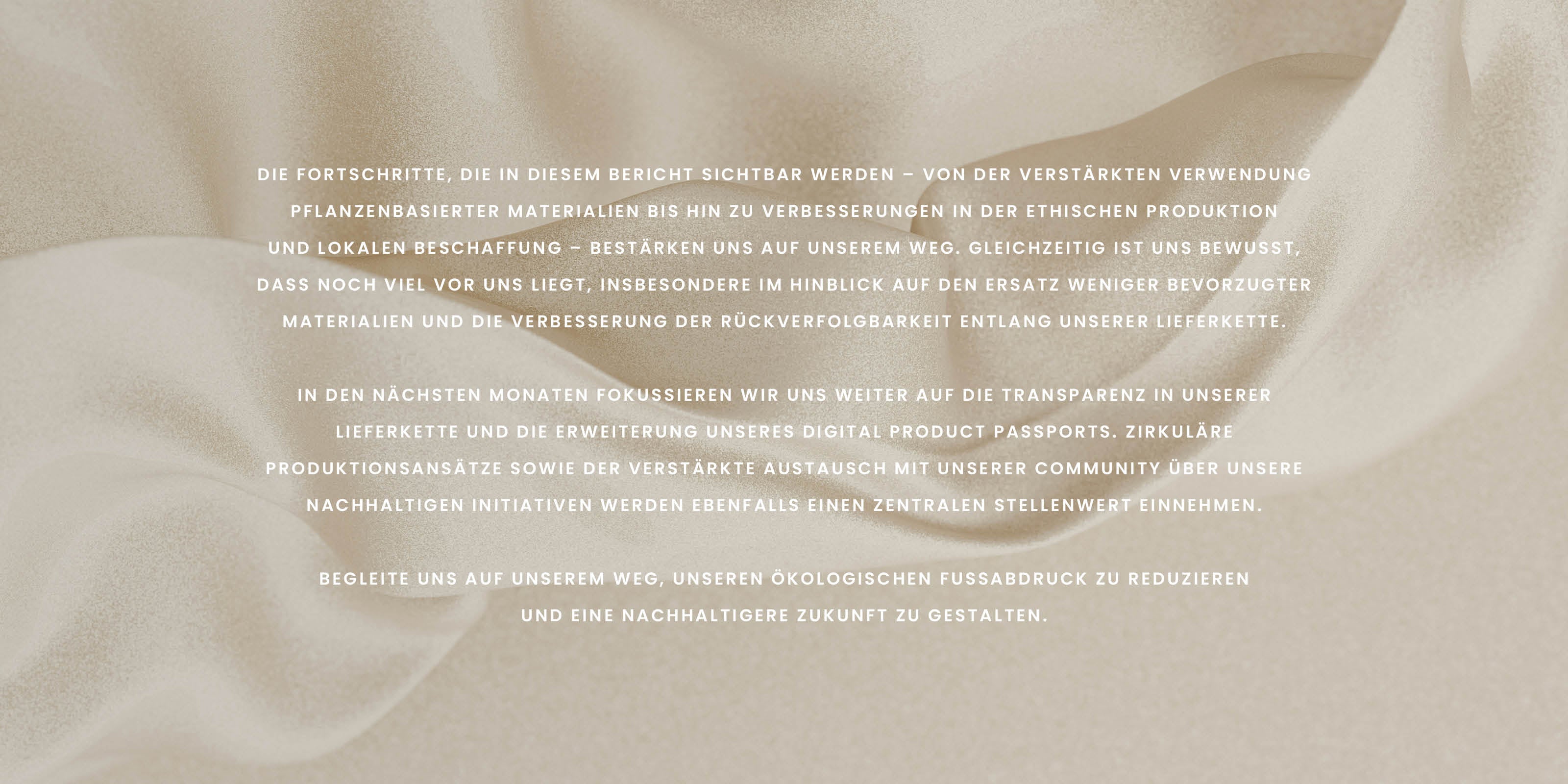 Text in German on a beige, silky fabric background discussing sustainability and future goals.