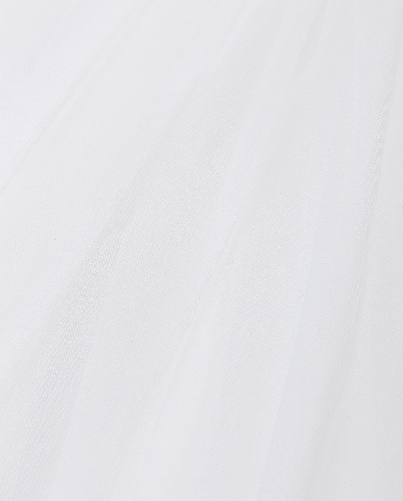 Close-up of the APHRODITE Veil by IVY OAK, featuring sheer white fabric with soft folds that highlight its delicate, transparent, and airy texture.