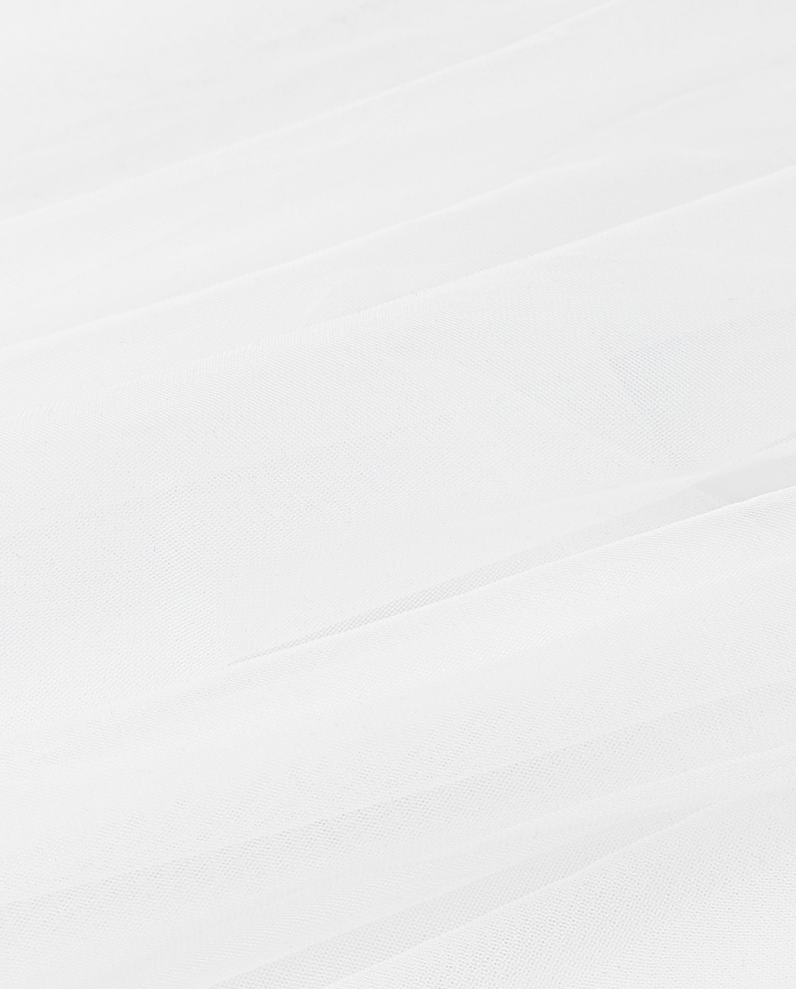 The APHRODITE ROSE Veil by IVY OAK features layered sheer white fabric with soft folds, delicate lace accents, and a light, airy texture.