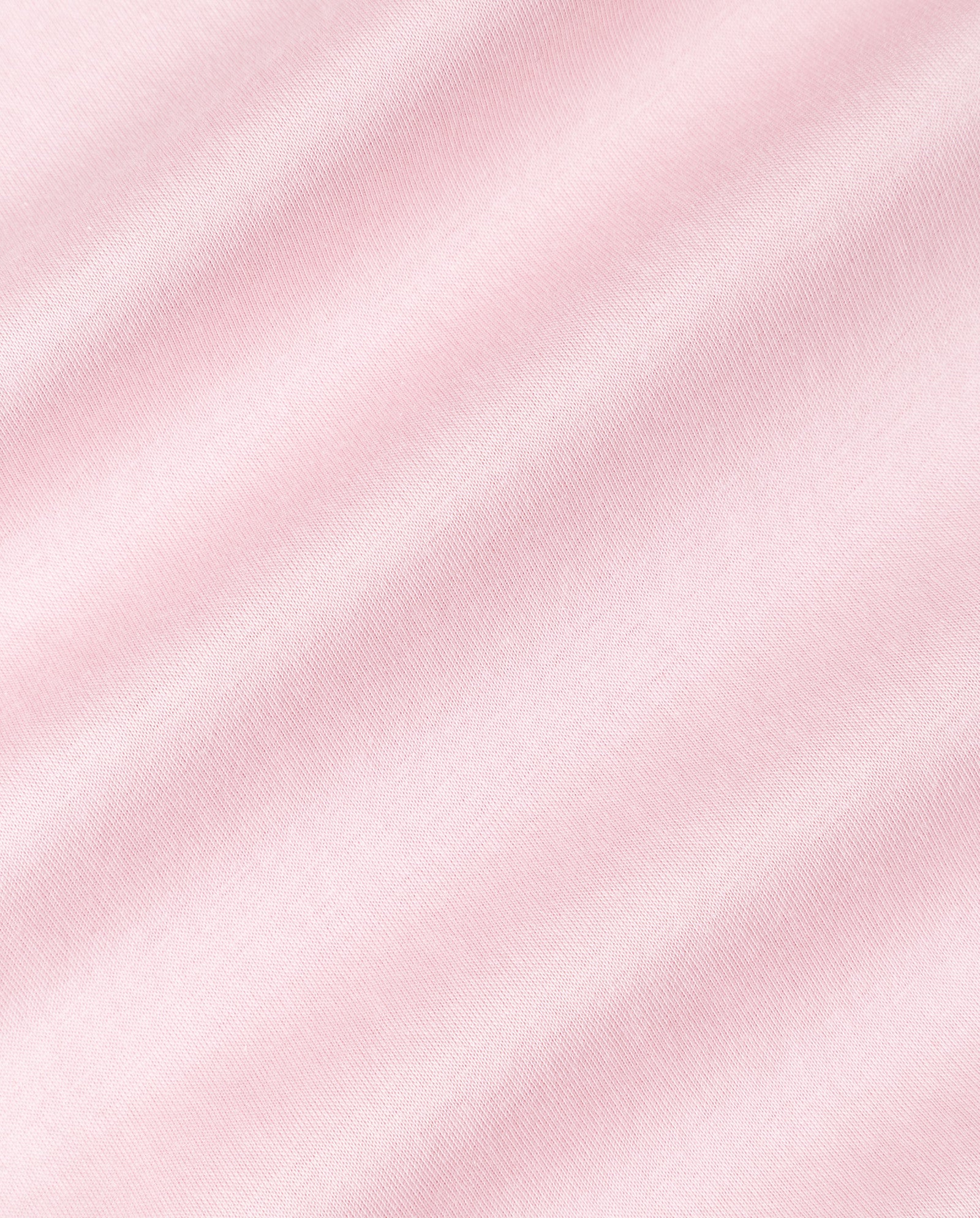 Light pink organic cotton fabric with soft diagonal folds and a smooth, slightly textured surface—perfect for the KYLA Top by IVY OAK or your essential wardrobe staple.