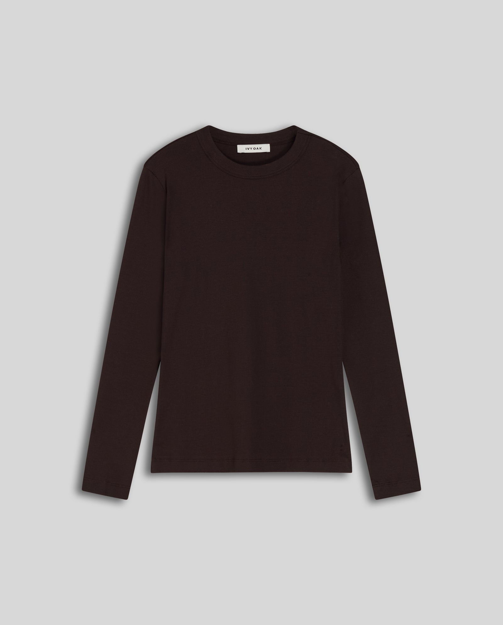 The IVY OAK KOLLINA Top, a black long-sleeve round neck t-shirt, is laid flat on a light gray background. Made from Organic Cotton for comfortable everyday wear.