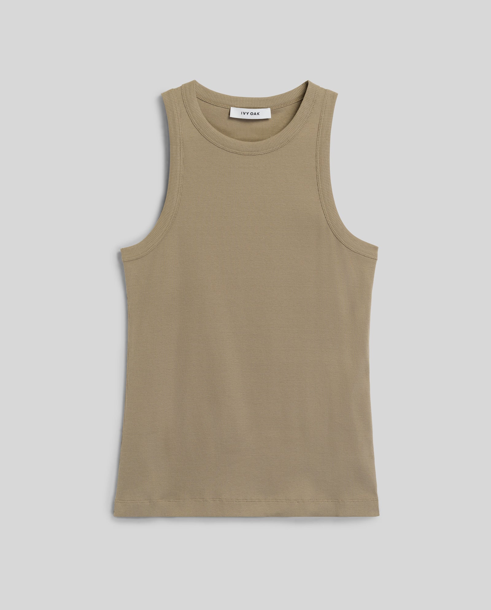 The KLARA ANN Top by IVY OAK is a beige sleeveless tank with a classic round neck, crafted from organic cotton and shown laid flat on a light gray background.