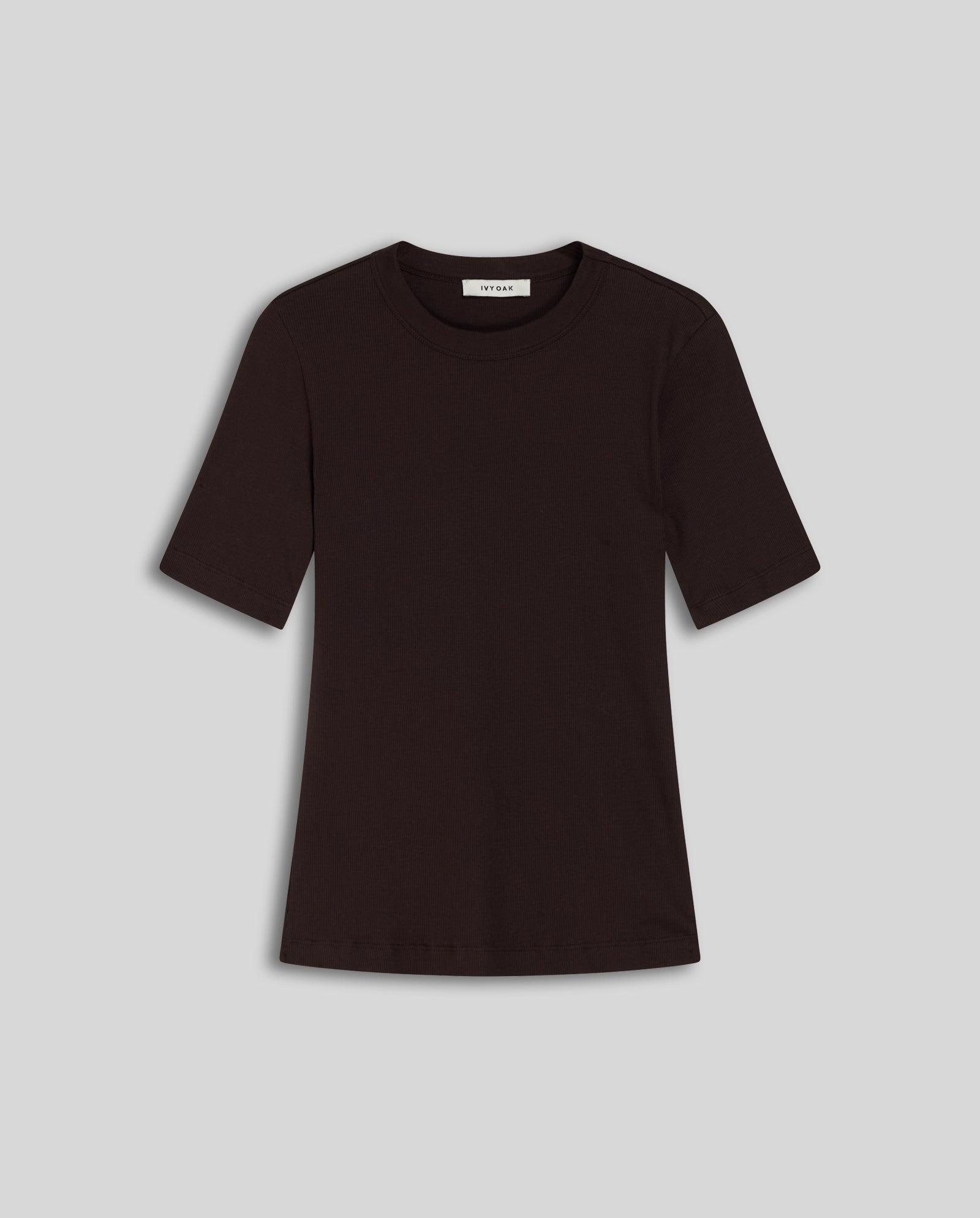 A plain black IVY OAK KRISTIN Top made from comfortable organic cotton, laid flat on a light gray background.