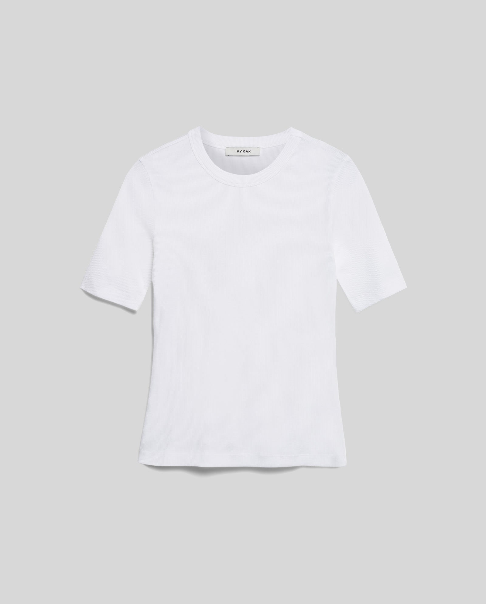 The KRISTIN Top from IVY OAK is a comfortable, plain white short-sleeve tee made from organic cotton, shown against a light gray background.