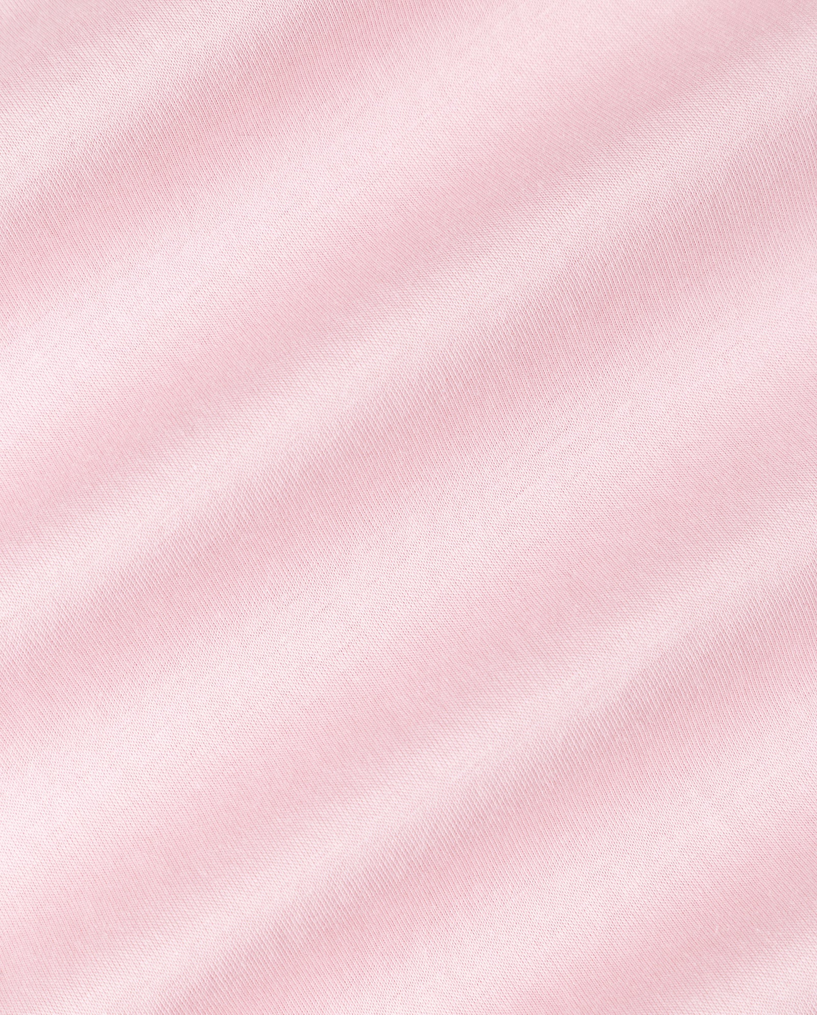 The KYLA ROSE Top by IVY OAK features soft pink fabric with diagonal texture lines, offering a gentle and smooth look—perfect for an ultra-soft T-shirt you’ll want to wear every day.