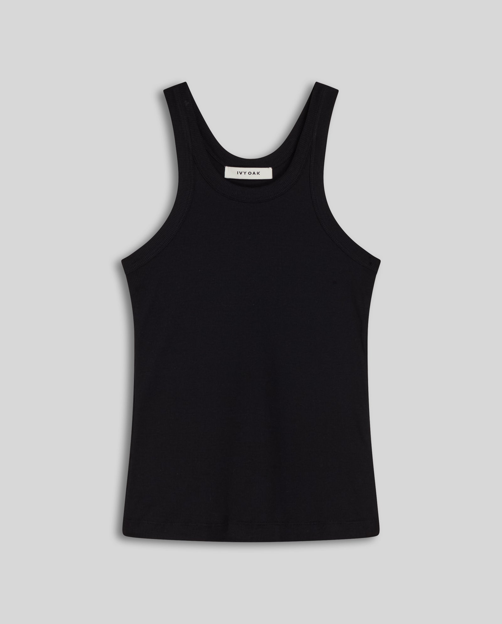 The IVY OAK FINLEY Top is a black ribbed tank with a scoop neckline, shown against a light gray background.