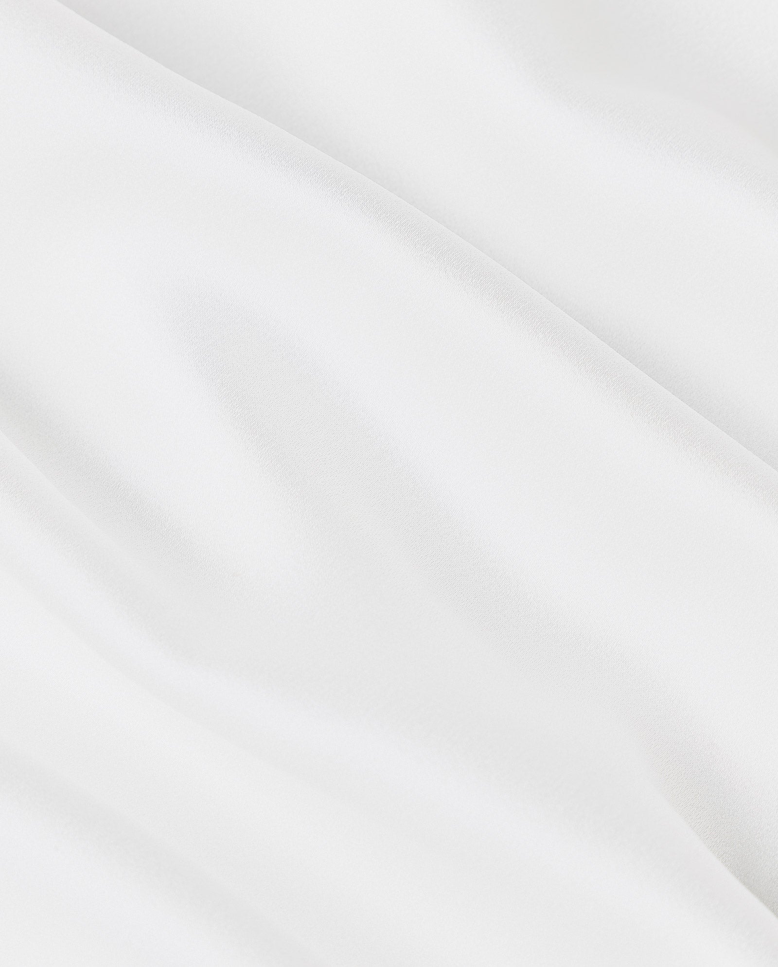 The STEVIA Bridaldress by IVY OAK features white silk fabric with soft, smooth folds and a subtle sheen, ideal for designing a flowing bridal gown in maxi length.