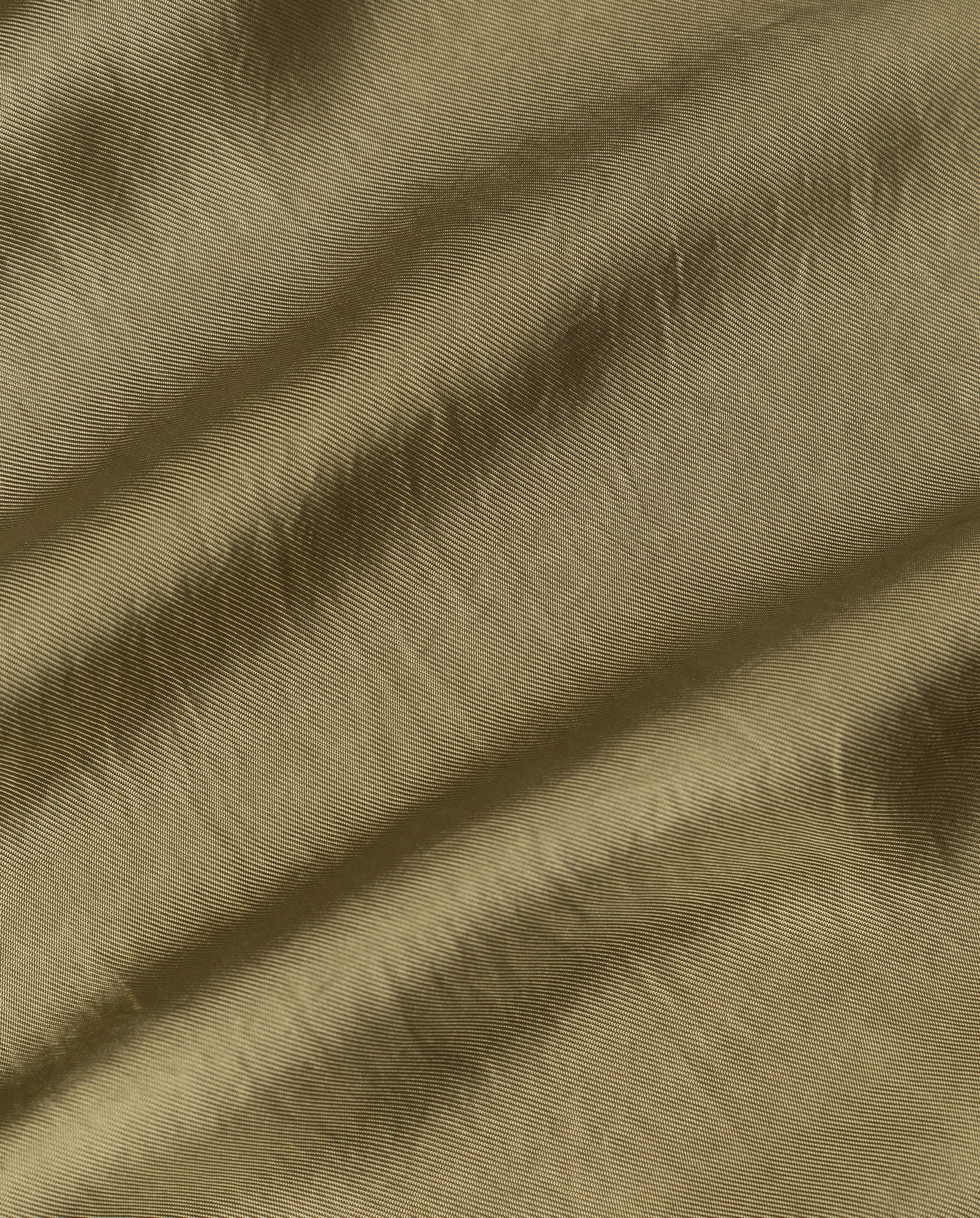 Close-up of the ELOISE Top by IVY OAK, featuring light brown organza fabric with a soft texture and visible horizontal creases.