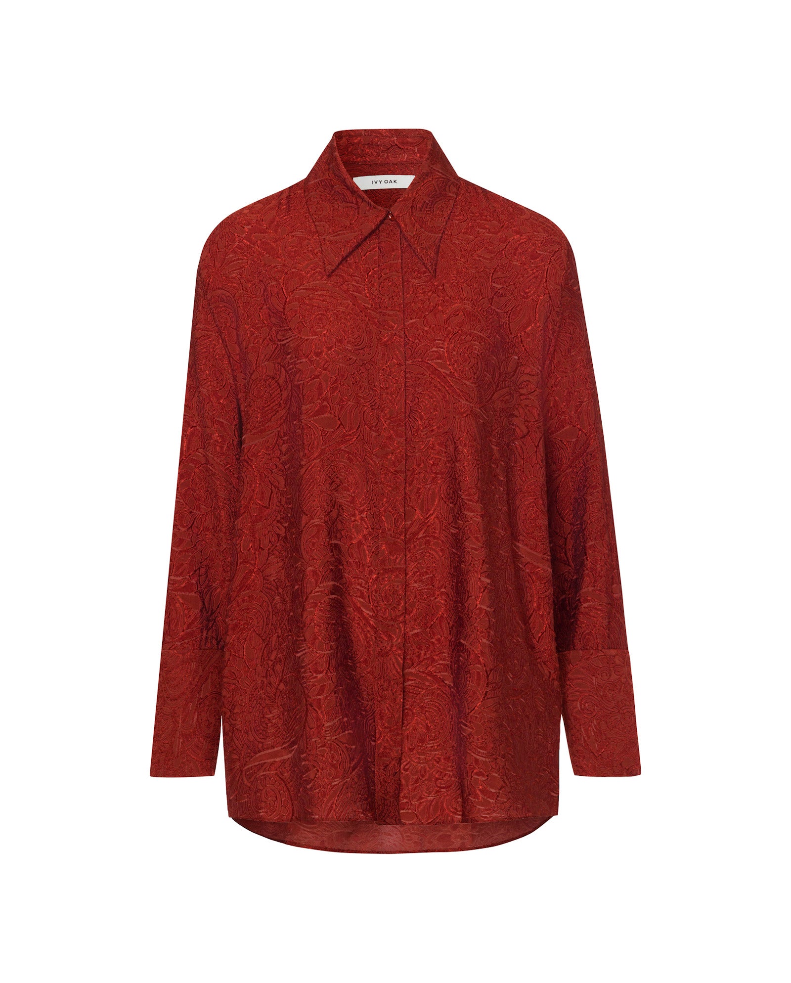 The ELVIE ANN Blouse by IVY OAK is a long-sleeve, button-up red top featuring a subtle floral texture and wide collar, displayed on a plain white background.
