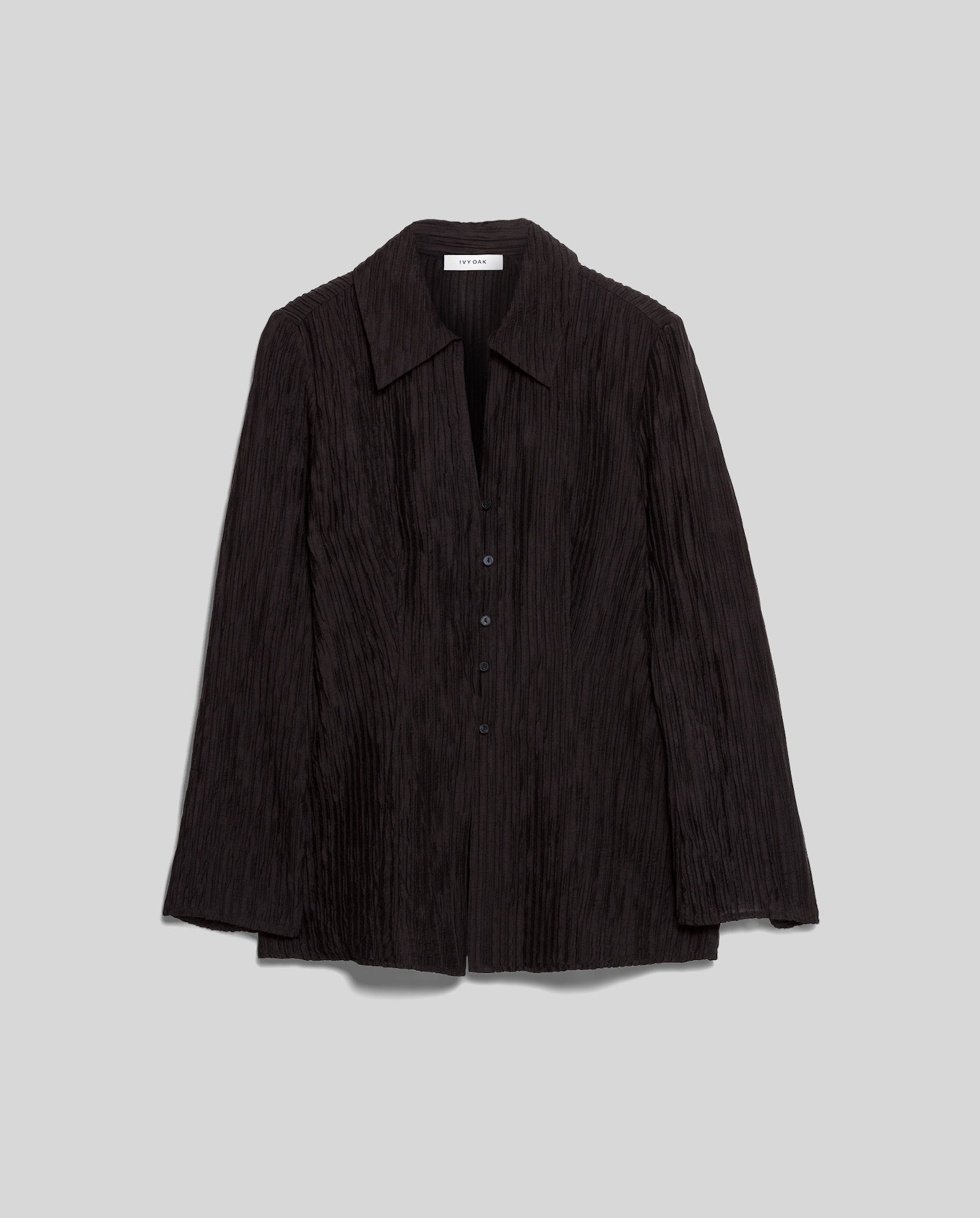 The IVY OAK EVELYN Blouse is a black, long-sleeve button-up with a crinkled texture, evoking the look of pleated viscose, shown against a plain gray background.
