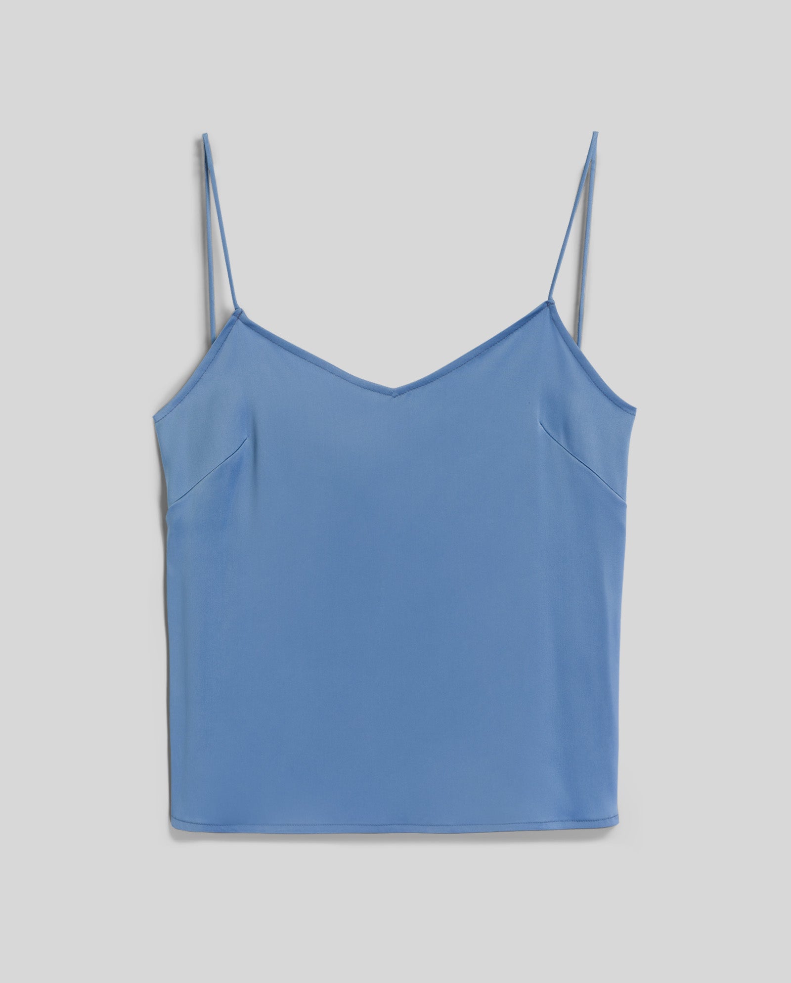 The IVY OAK TILDA ANN Straptop is a light blue sleeveless top with a flattering V-neck and thin adjustable spaghetti straps, shown laid flat on a white background.