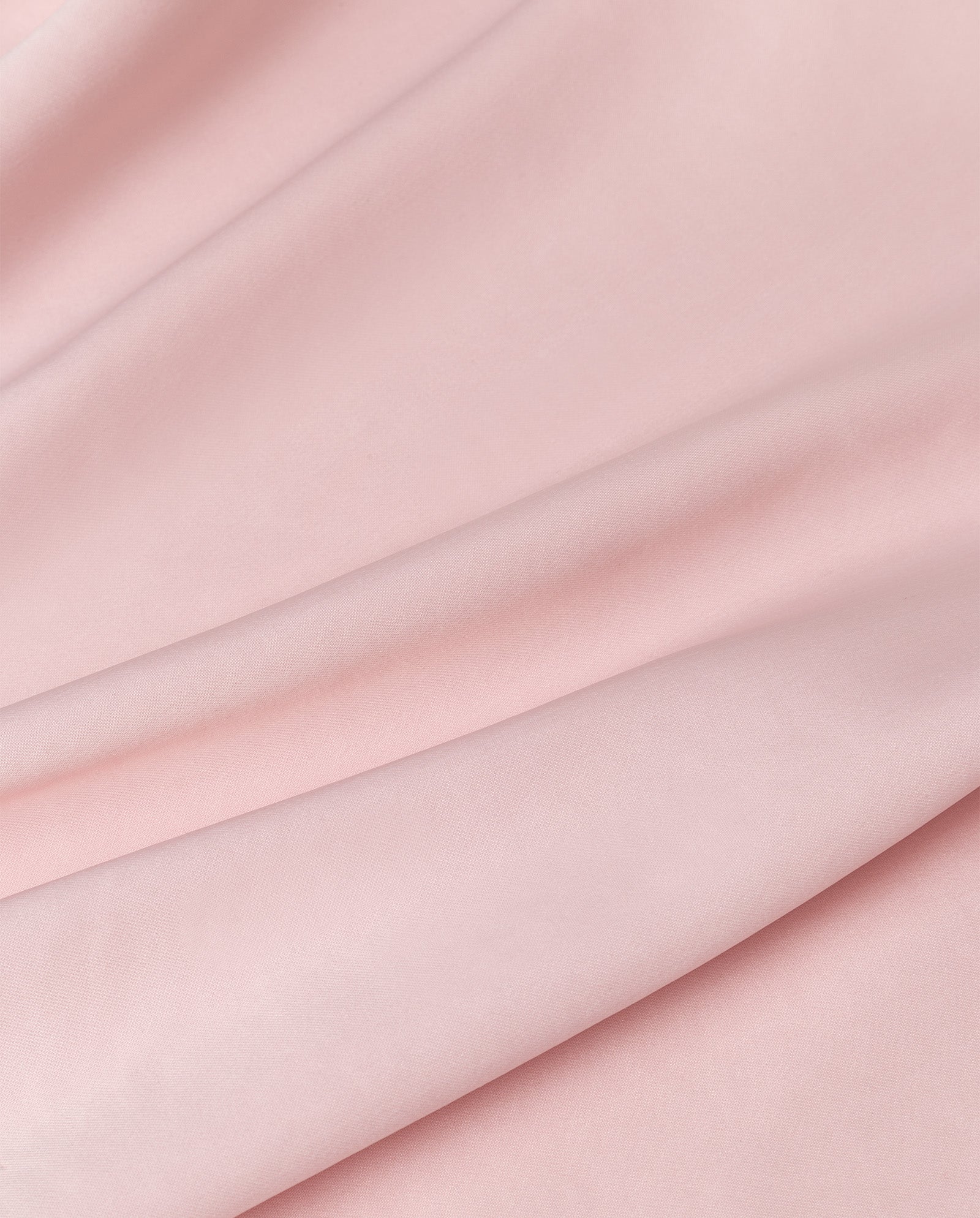 The TILDA ANN Straptop by IVY OAK features soft, light pink Naia acetate fabric with gentle folds and a smooth, matte texture.