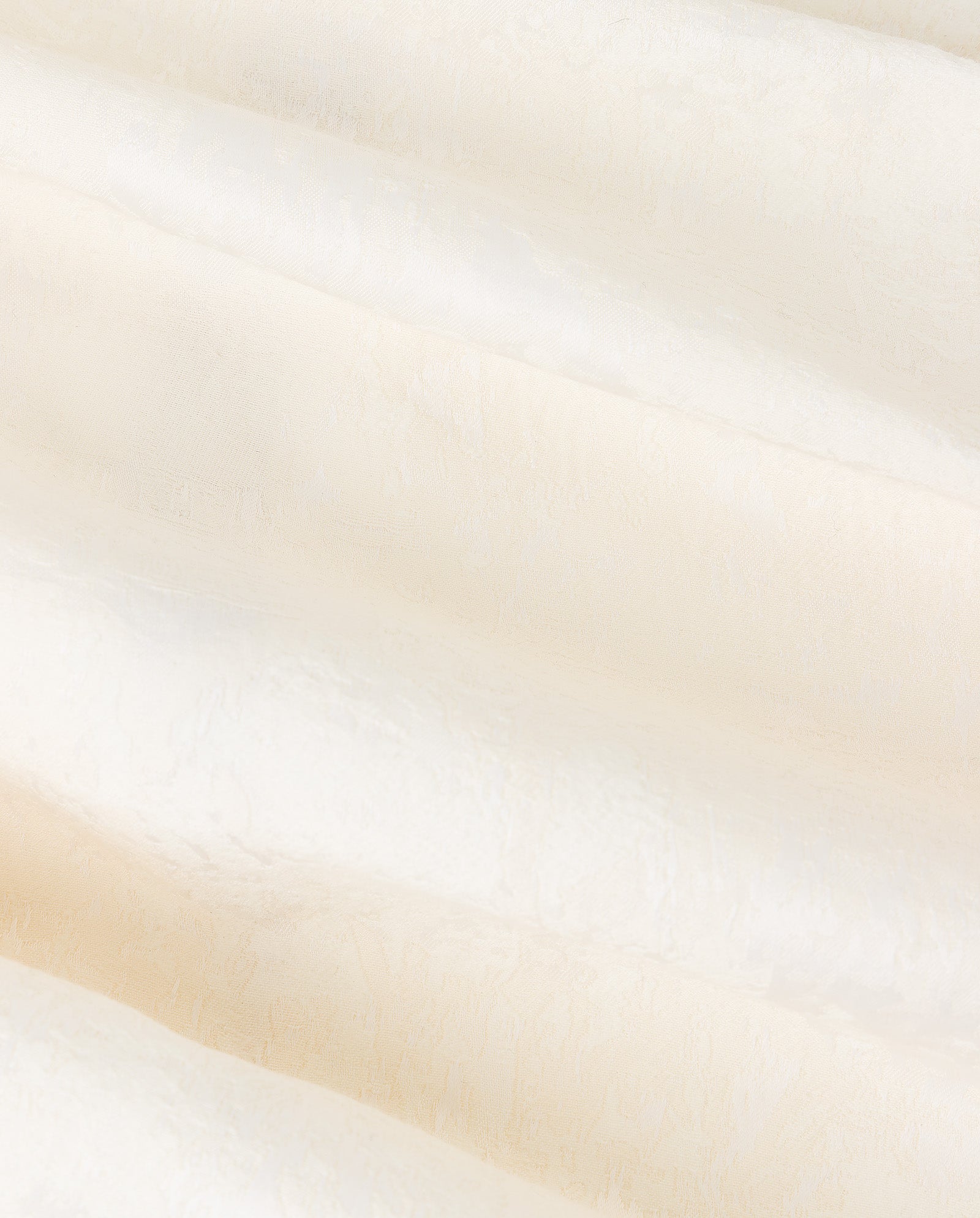 The ELISABETH Top by IVY OAK features ivory white jacquard fabric with a subtle textured pattern and soft, flowing folds.