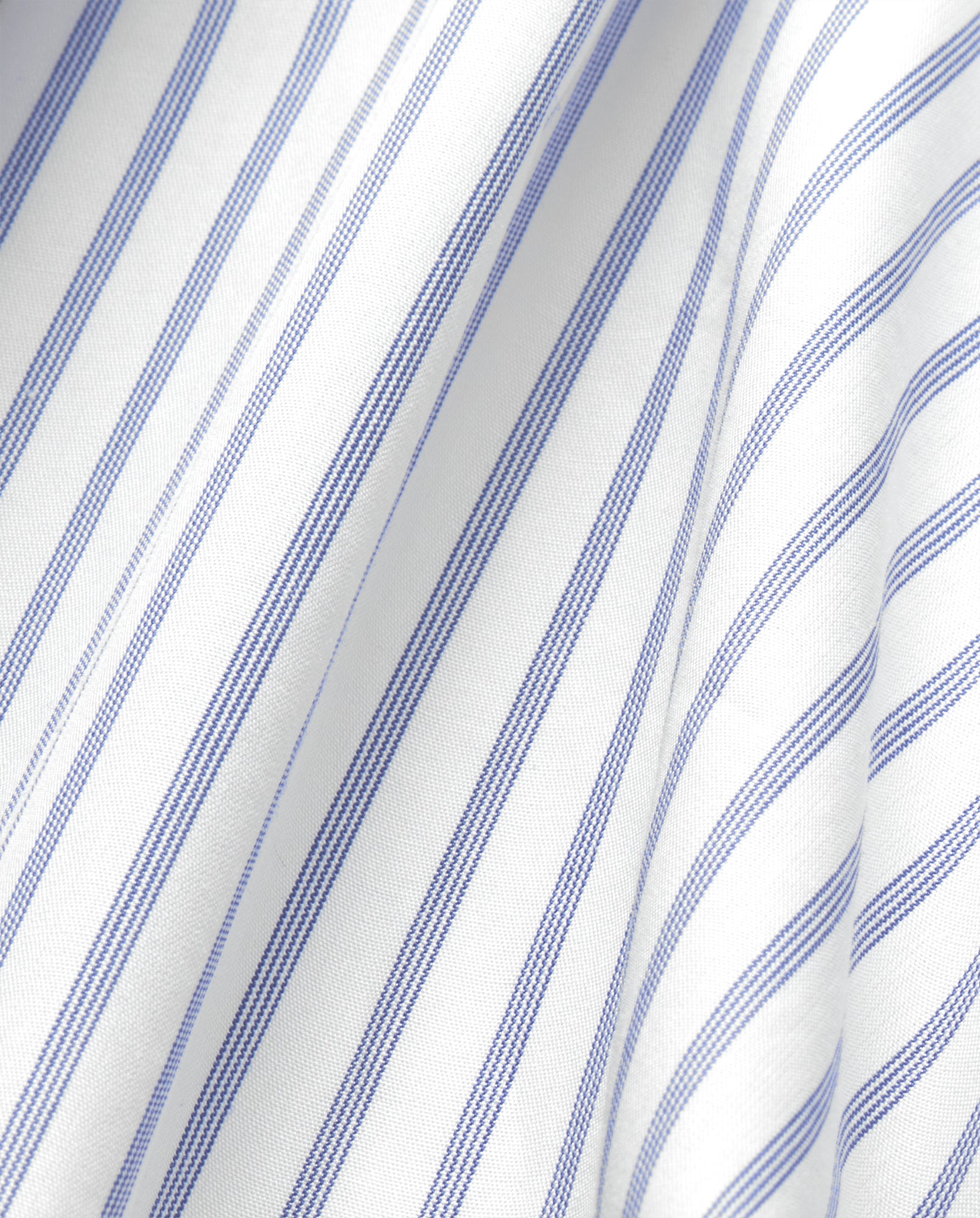 Close-up of the EVE Blouse by IVY OAK, featuring an oversized fit in white fabric with blue vertical stripes.