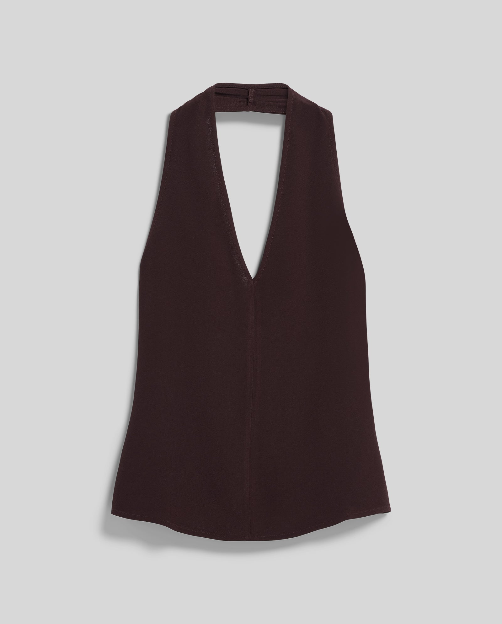 The IVY OAK TANSY Top is a sleeveless black crepe halter with a deep V-neckline, shown laid flat on a light gray background.