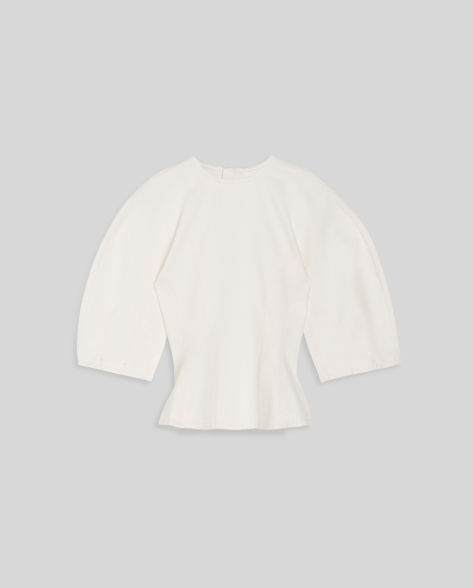 The IVY OAK ELMA Blouse is a white, long-sleeve top featuring wide-shoulder sleeves and a fitted waist for a subtle peplum effect, shown on a plain gray background.