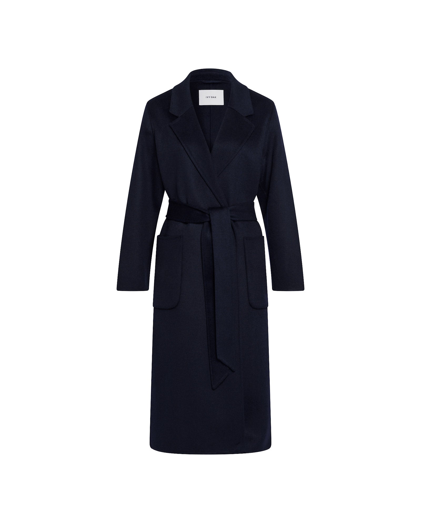 The CELIA Doubleface Coat by IVY OAK is a long black wool midi coat with large front pockets and a belted waist, shown on a white background.