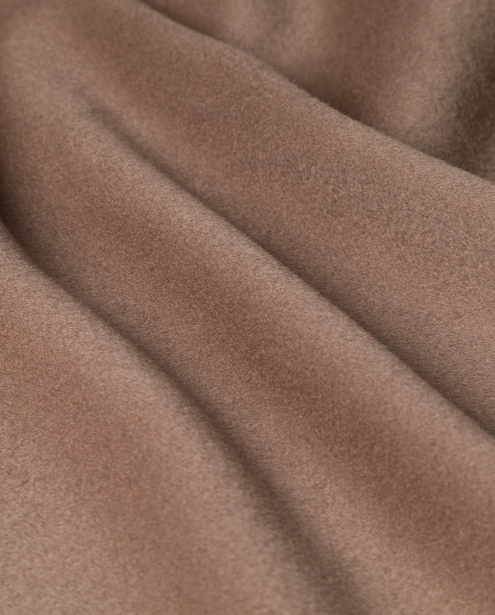 Close-up of the soft, brown fabric with smooth folds and velvety texture—ideal for the IVY OAK CARRIE ROSE Wool Coat, thoughtfully crafted to meet the Responsible Wool Standard.