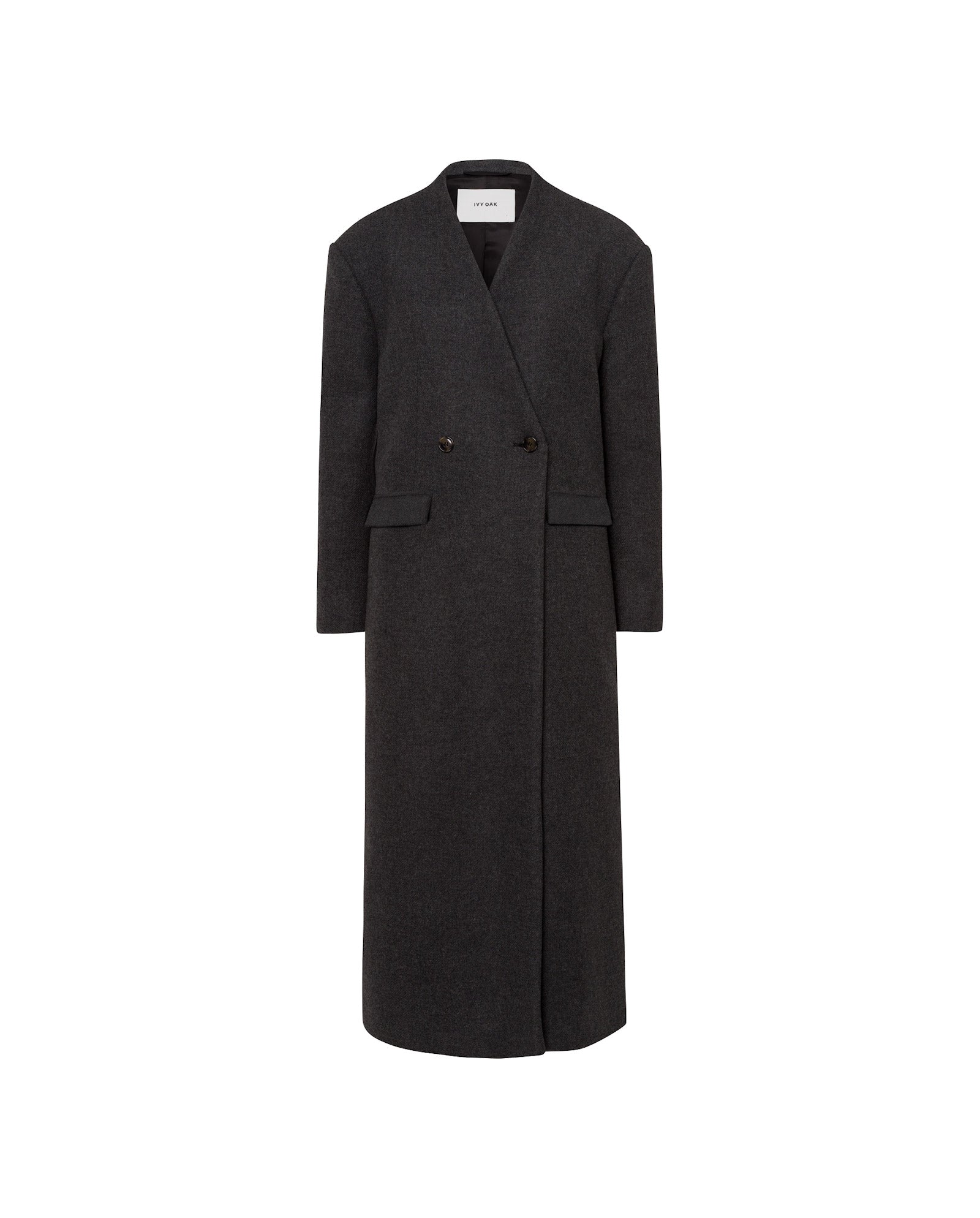 The IVY OAK CAPRI Coat is a long, dark gray, double-breasted MWOOL® wool coat with flap pockets and no visible collar, shown in maxi length against a white background.