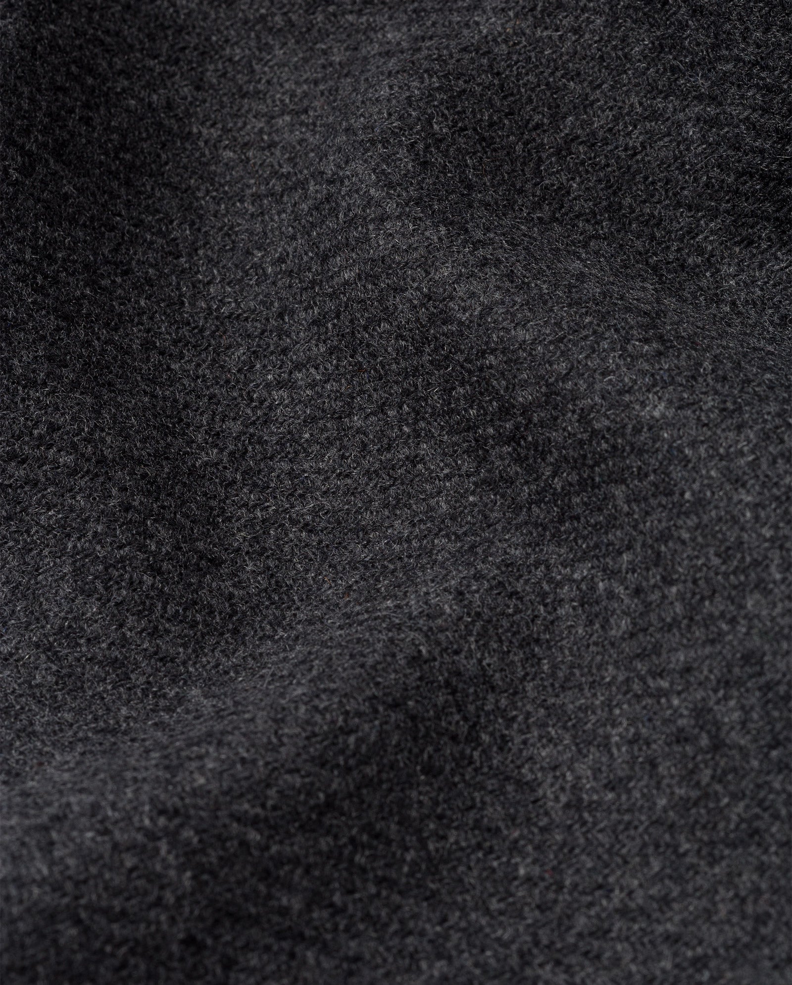 Close-up of soft, dark gray fleece fabric with a textured, wavy surface, perfect for the IVY OAK CAPRI Coat.