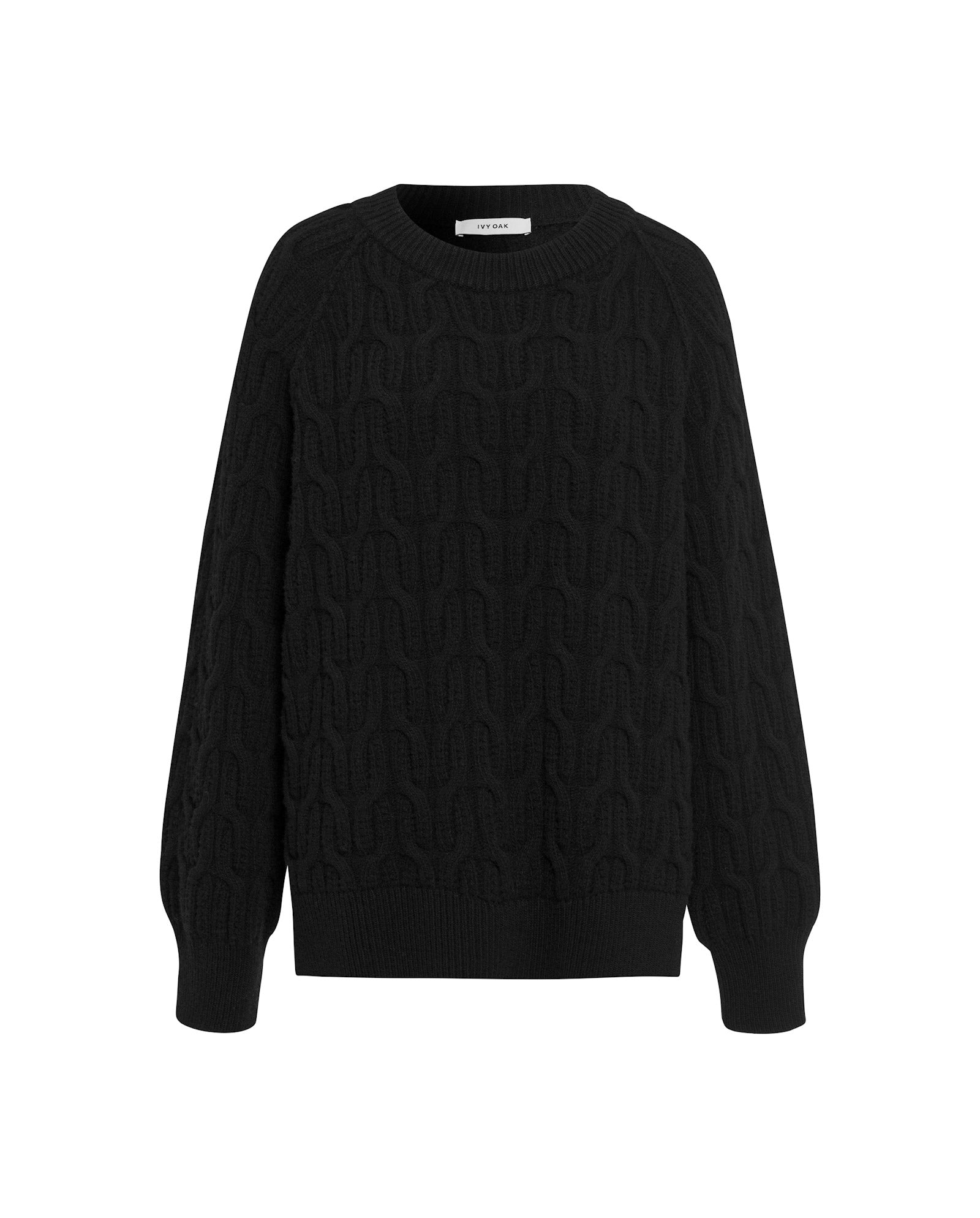 The KLARINA Jumper by IVY OAK is a black cable knit sweater with long sleeves and a round neckline, made from extrafine merino wool for a soft feel, shown on a white background.