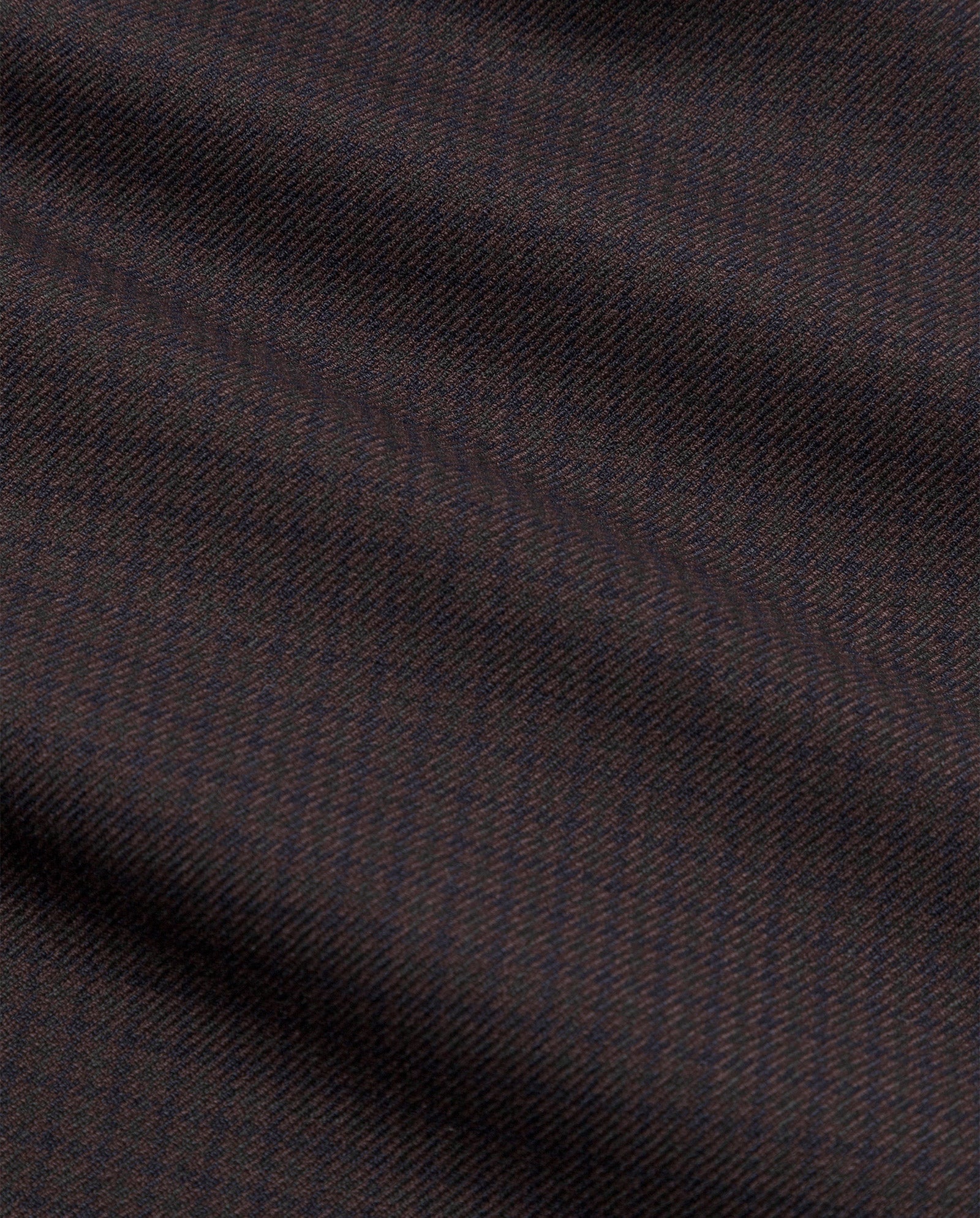 Close-up of dark brown and black herringbone fabric with diagonal textured ridges, used in IVY OAKs PEONY ROSE Wide Leg Pants—ideal for a coordinated look.