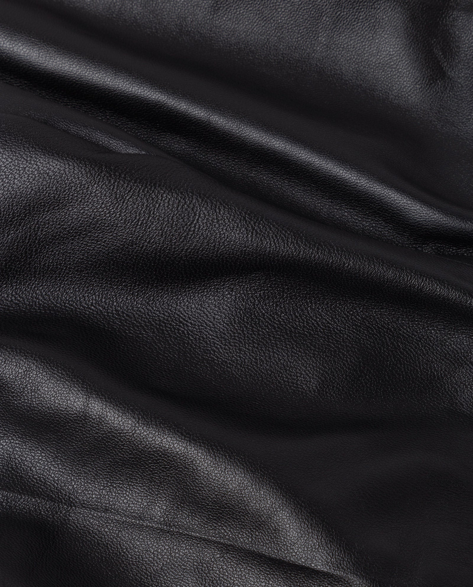 Close-up of the IVY OAK LAURA Pants in black leather, showcasing visible texture, natural creases, and a slim fit design.