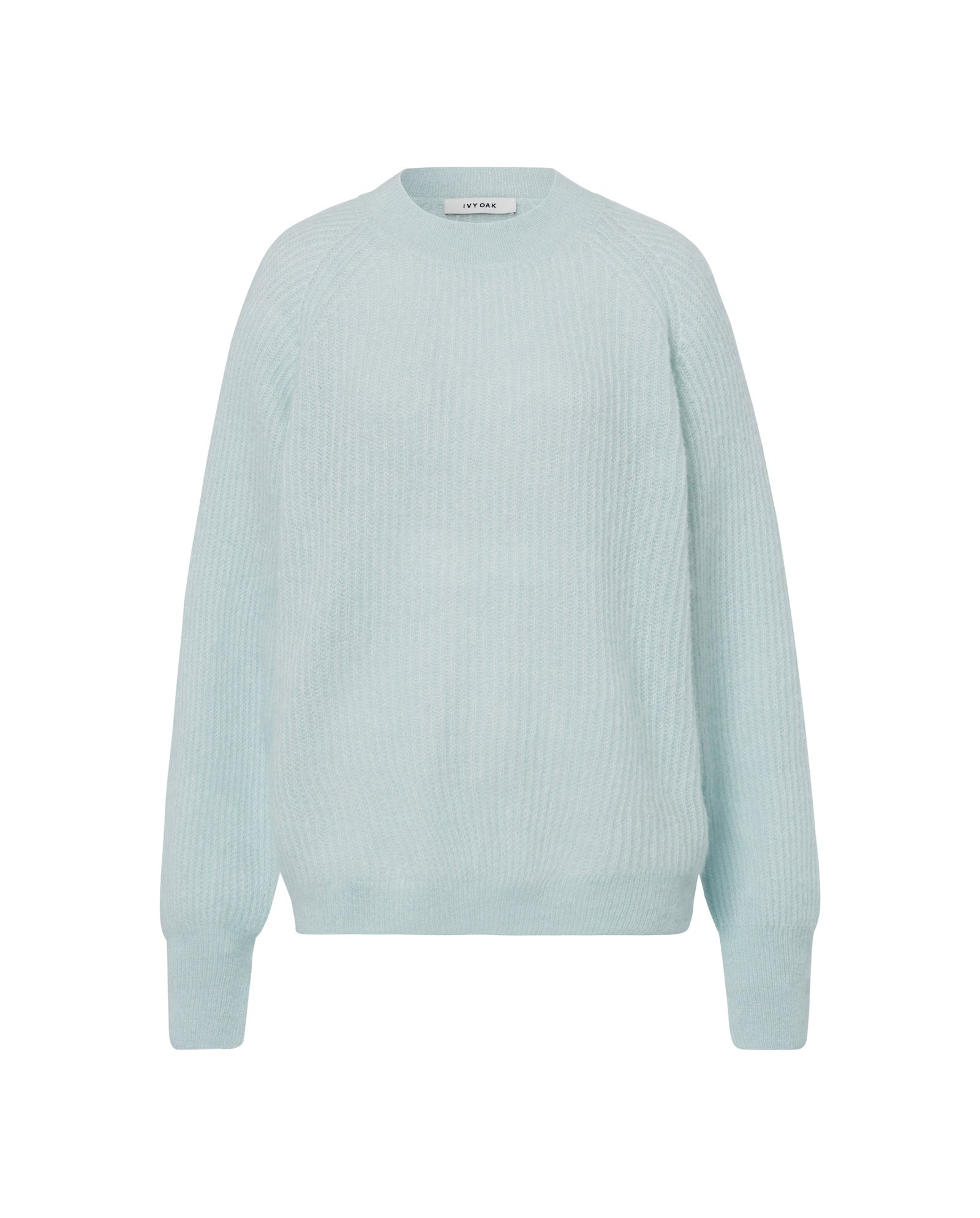 The IVY OAK KIRSTEN Jumper in light blue features raglan sleeves, ribbed cuffs and hem, and a crew neckline, all crafted from a cozy alpaca blend. Displayed against a white background.