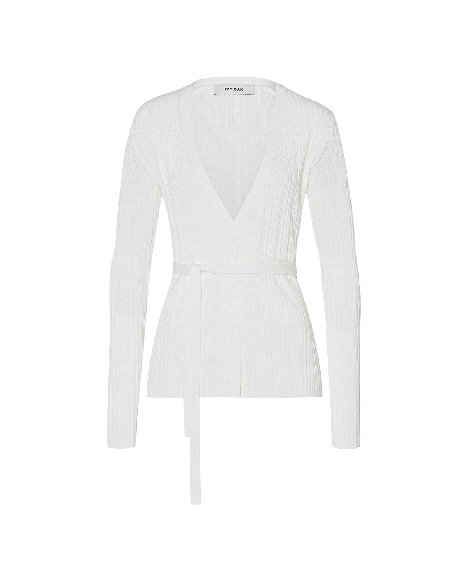 The IVY OAK KIERA Cardigan is a white long-sleeve ribbed wrap with a tie belt, elegant sleeves, and an irregular knit structure, shown on a plain white background.
