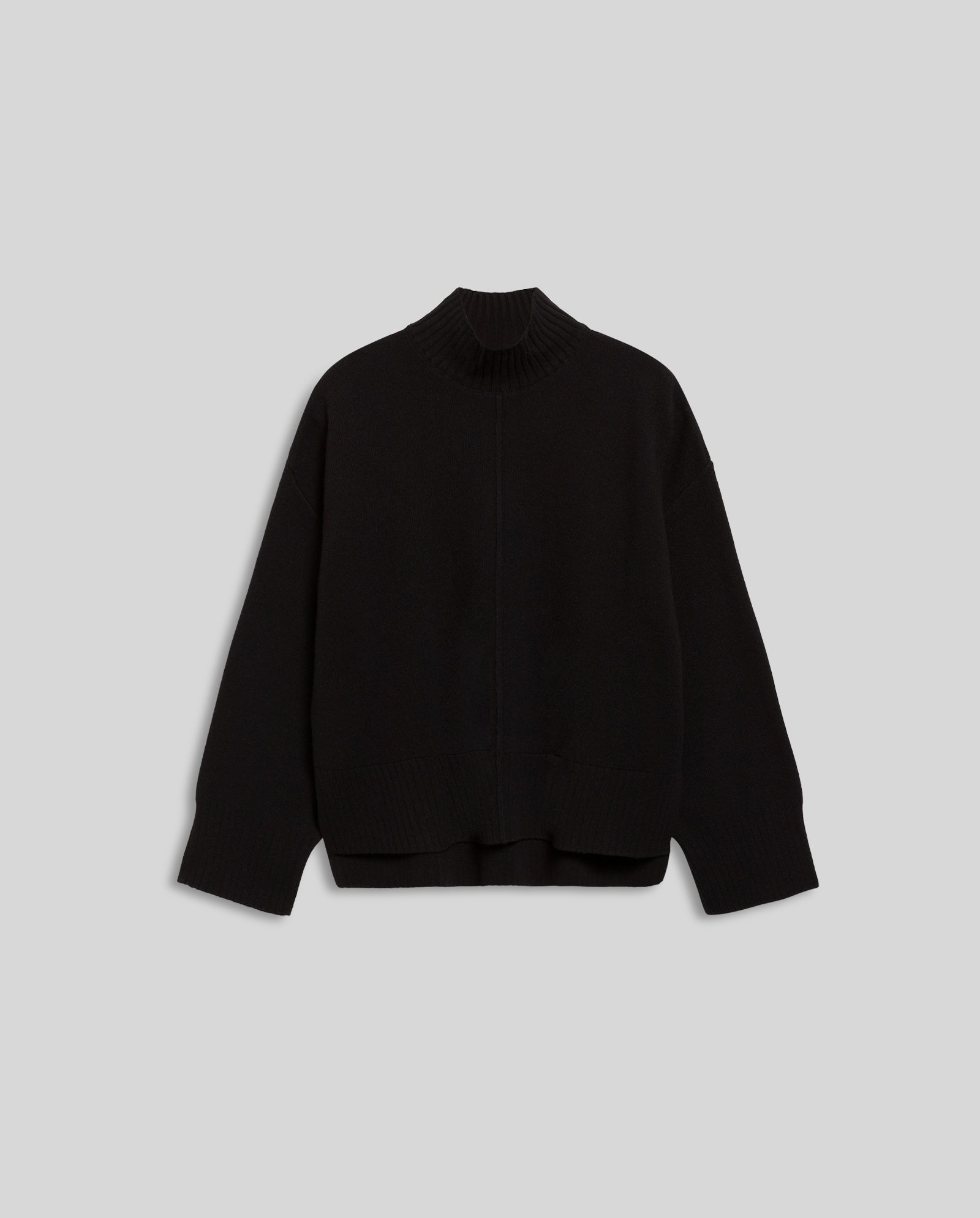 The IVY OAK KAREEN ROSE Jumper is a black, long-sleeve, high-neck sweater made from soft Merino wool, shown on a light gray background.