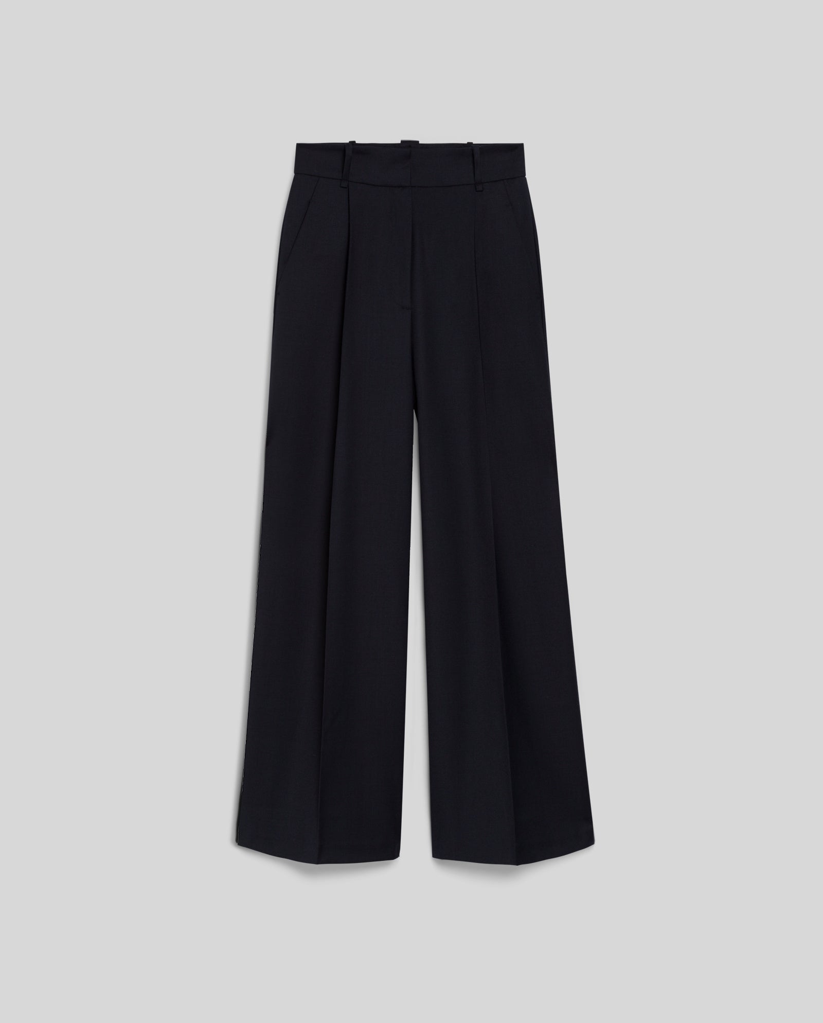 The IVY OAK PRESCILLIA Trousers feature wide-leg black tailoring with pleats and adjustable length, shown on a light grey background.
