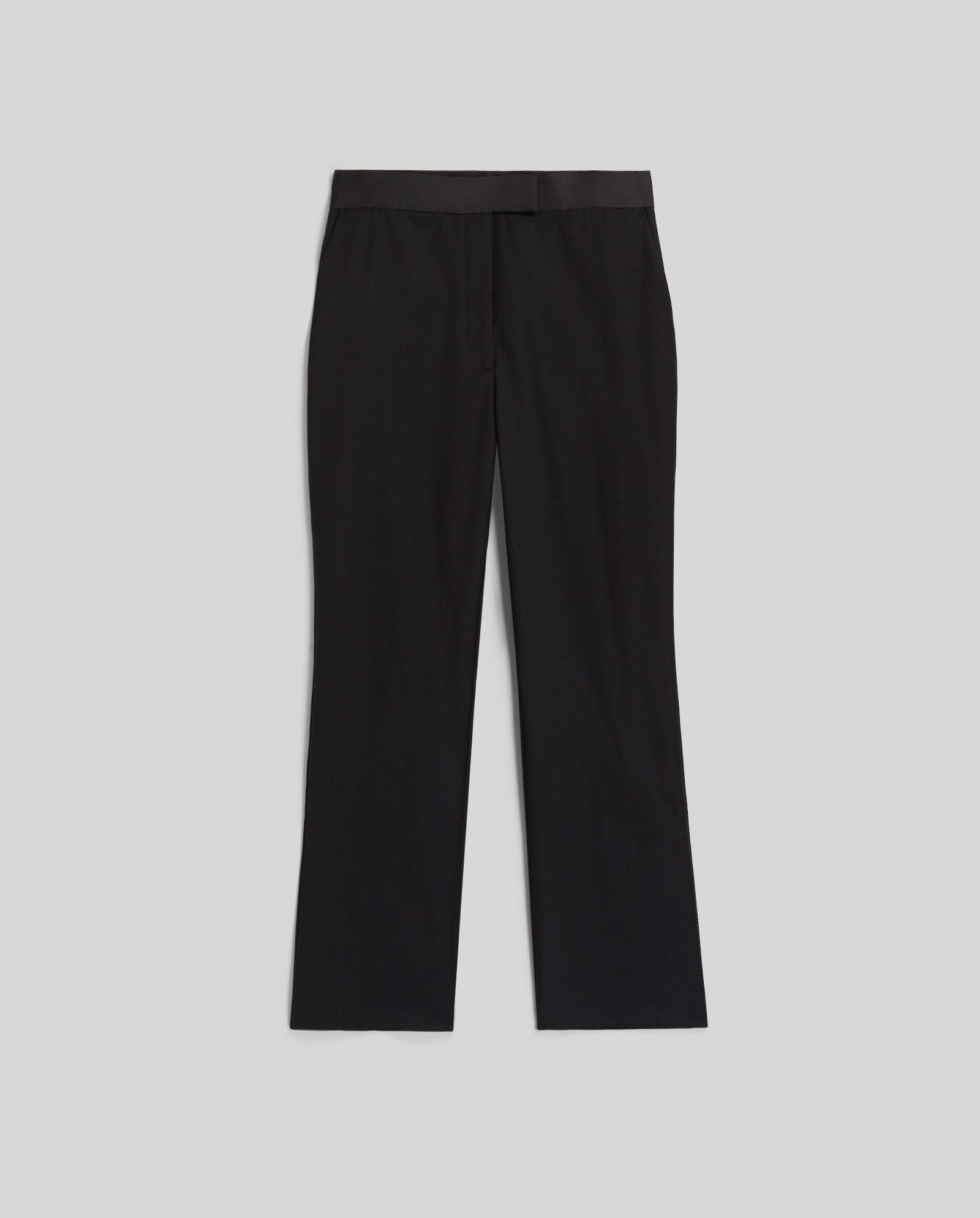 The IVY OAK POLINA ROSE Trousers are black, fitted, and feature a straight-leg cut with a shiny waistband, shown laid flat on a light gray background.