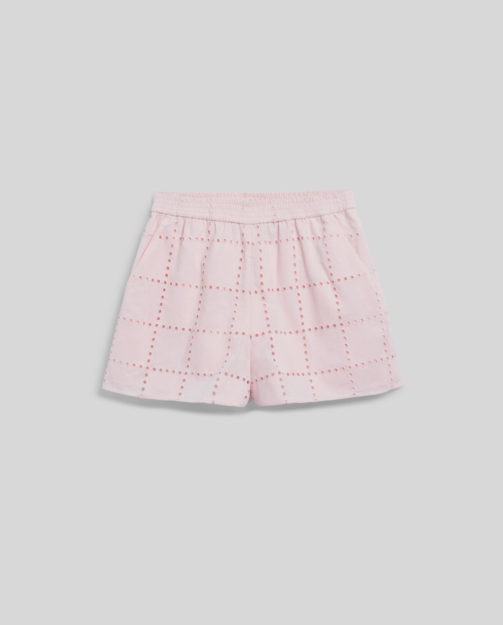 The IVY OAK PIPER SUE Trousers are light pink with broderie anglaise red-stitched squares, an elasticated waist, and soft inner lining, shown on a light grey background.