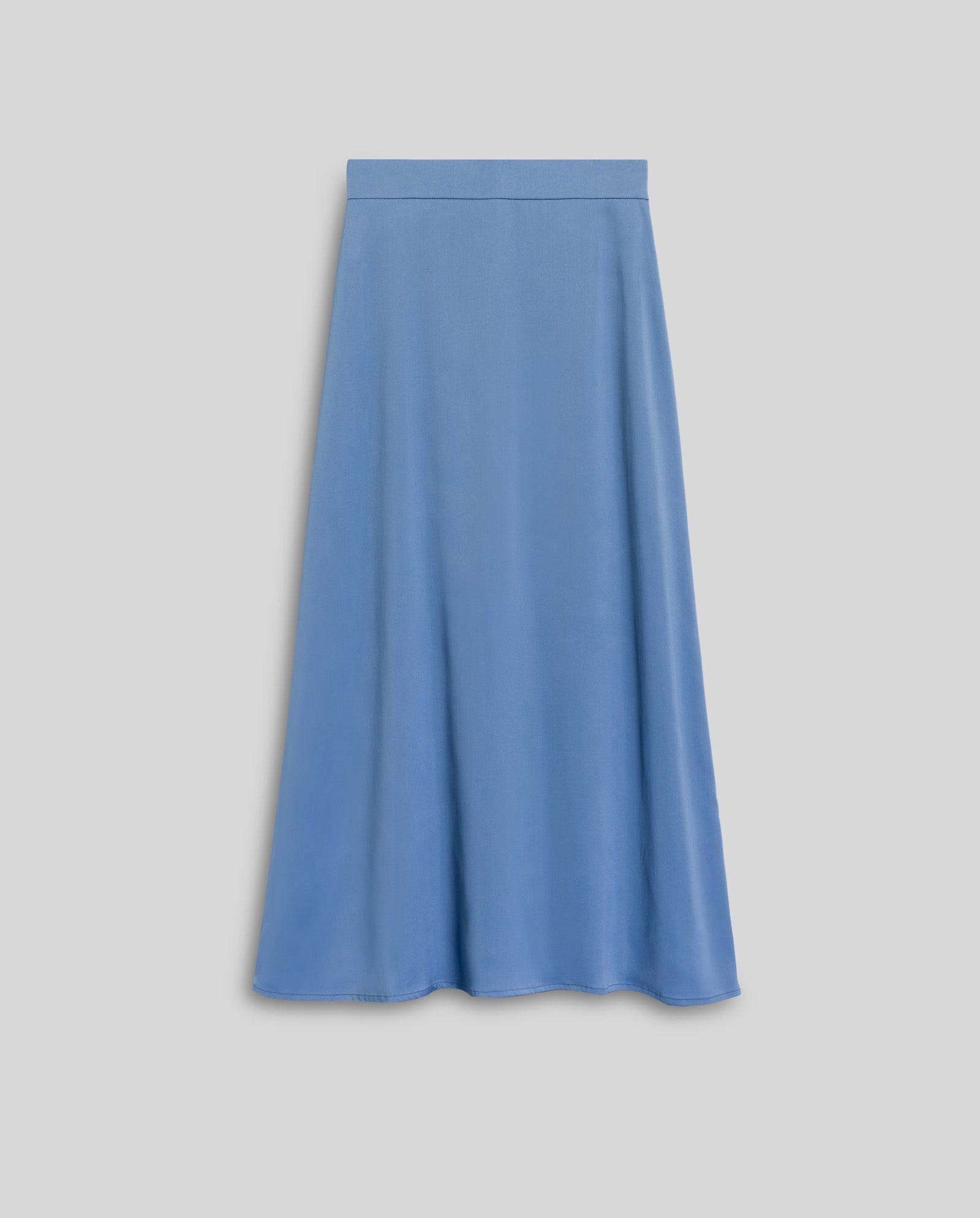 The IVY OAK SANNA Skirt is an A-line, light blue midi skirt with a smooth NAIA acetate texture, shown against a plain gray background.