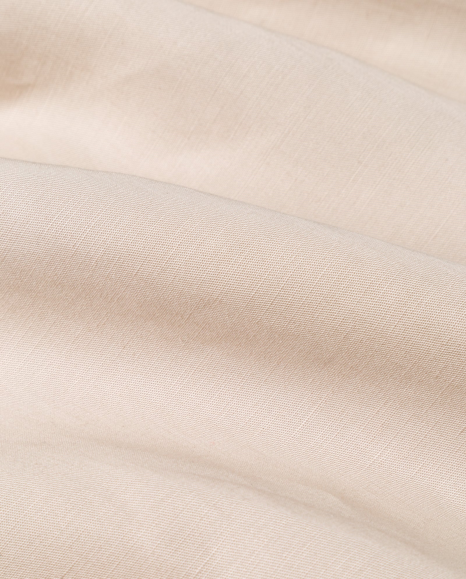 Close-up of soft, beige fabric with visible weave texture and gentle folds highlights the quality material of the IVY OAK SAMANTHA ANN Skirt.