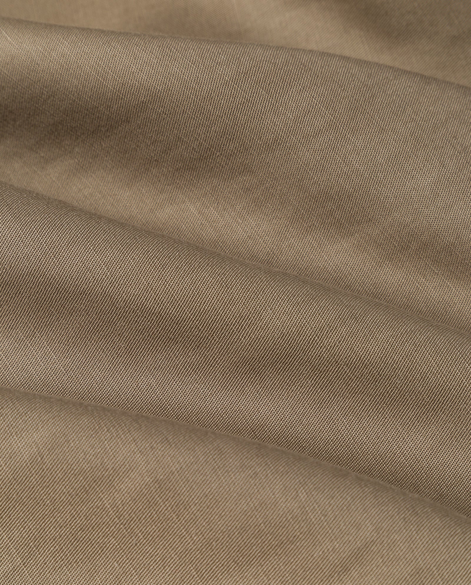 Close-up of light brown linen blend fabric with visible diagonal weaves and gentle folds, as featured on the IVY OAK SAMANTHA ANN Skirt.