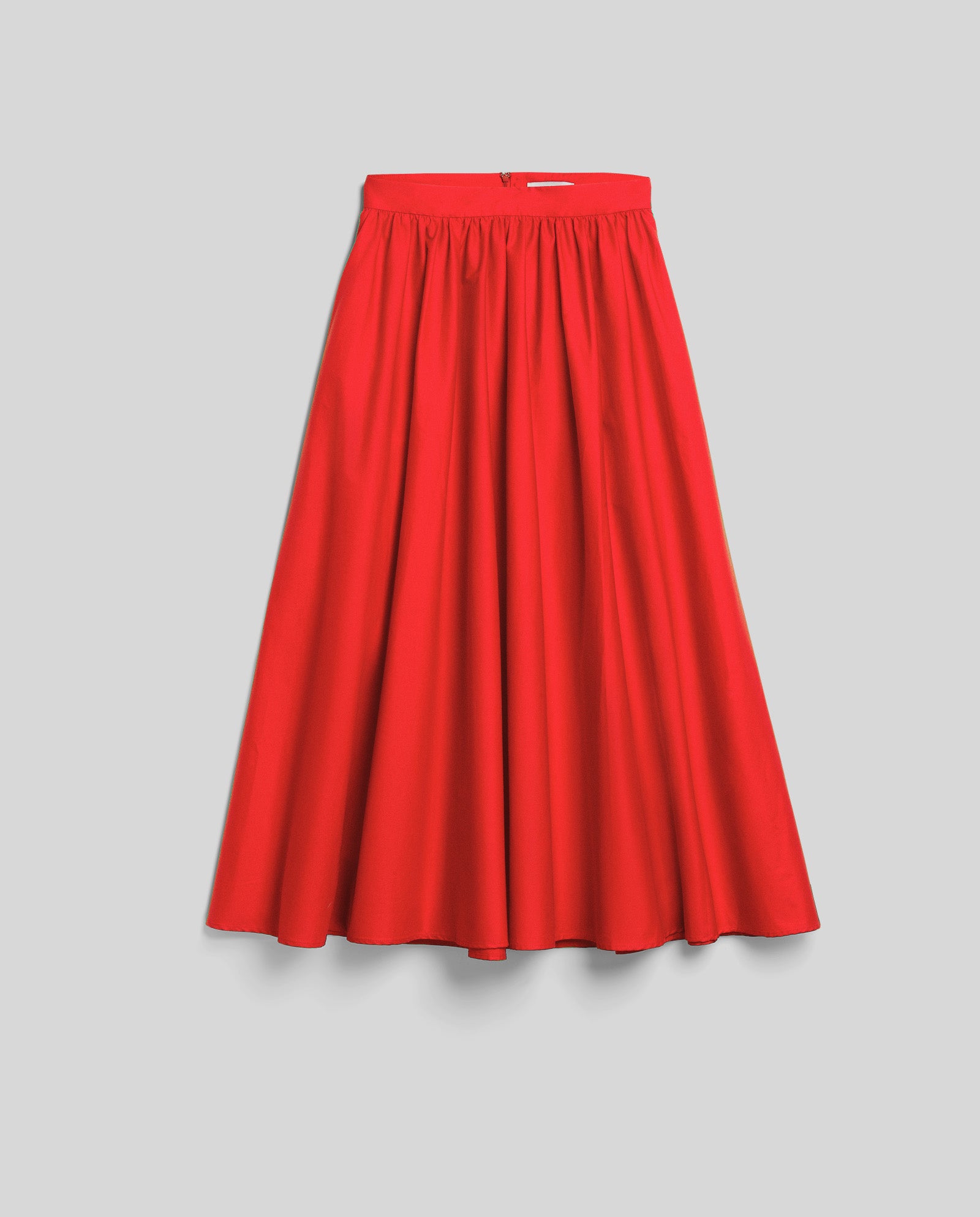 The IVY OAK SIENNA Skirt, a bright red, knee-length piece with a voluminous silhouette and gathered waistband, is shown against a light gray background.