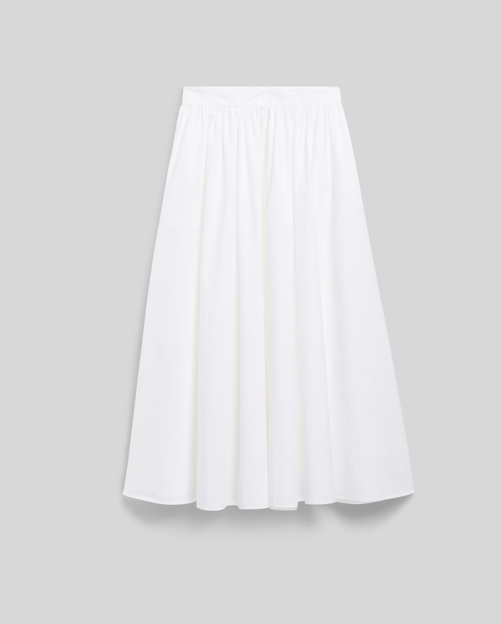 The SIENNA Skirt by IVY OAK is a white, knee-length A-line skirt featuring a voluminous gathered waist and fitted waistband, shown against a light grey background.