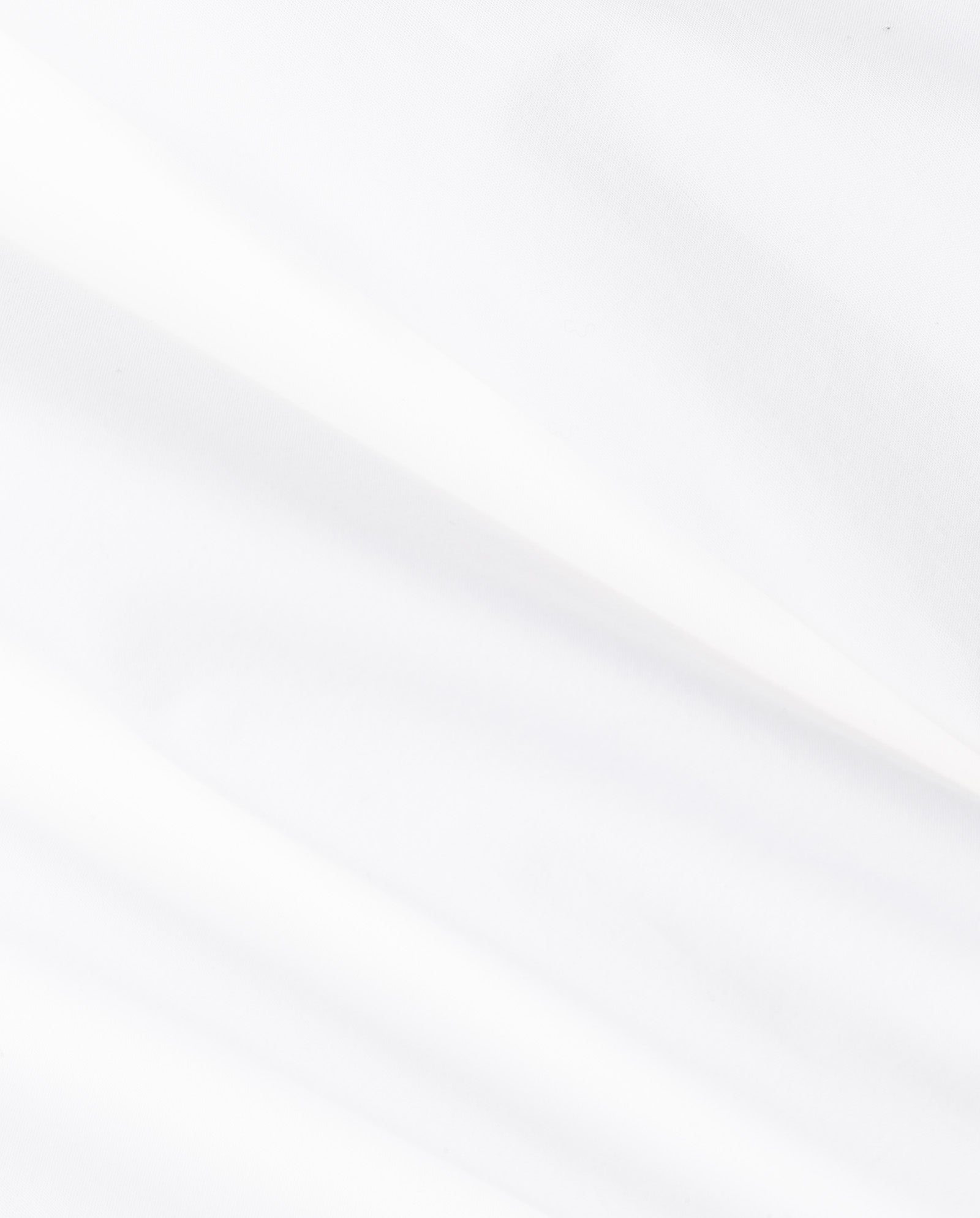 The IVY OAK SIENNA Skirt features soft white cotton with gentle folds and a smooth texture, creating a voluminous look with subtle shadows and light variations.