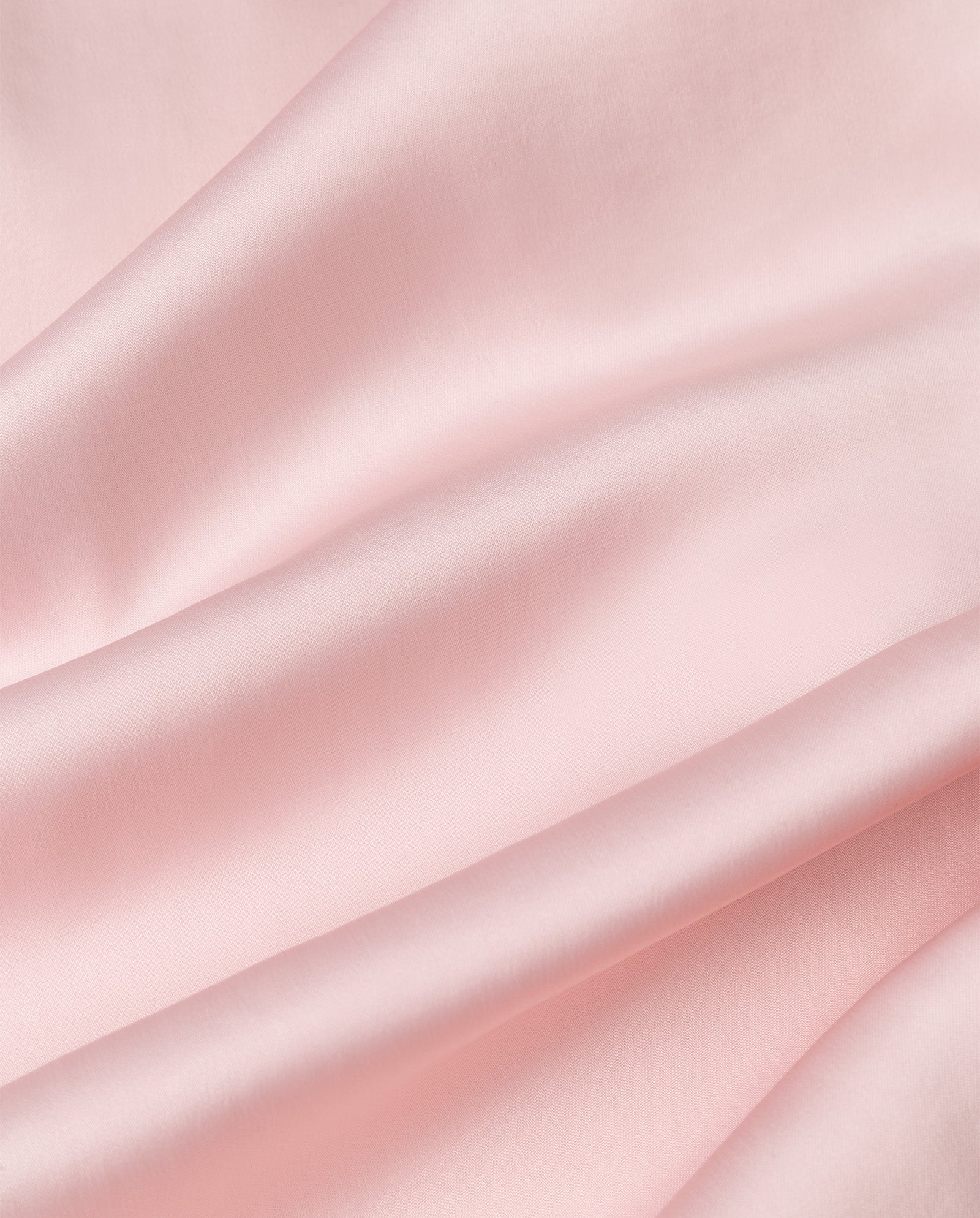 The IVY OAK MARCELLA LIZ Dress features smooth, light pink satin with gentle folds and a soft, glossy finish—ideal for a flowing, elegant look.