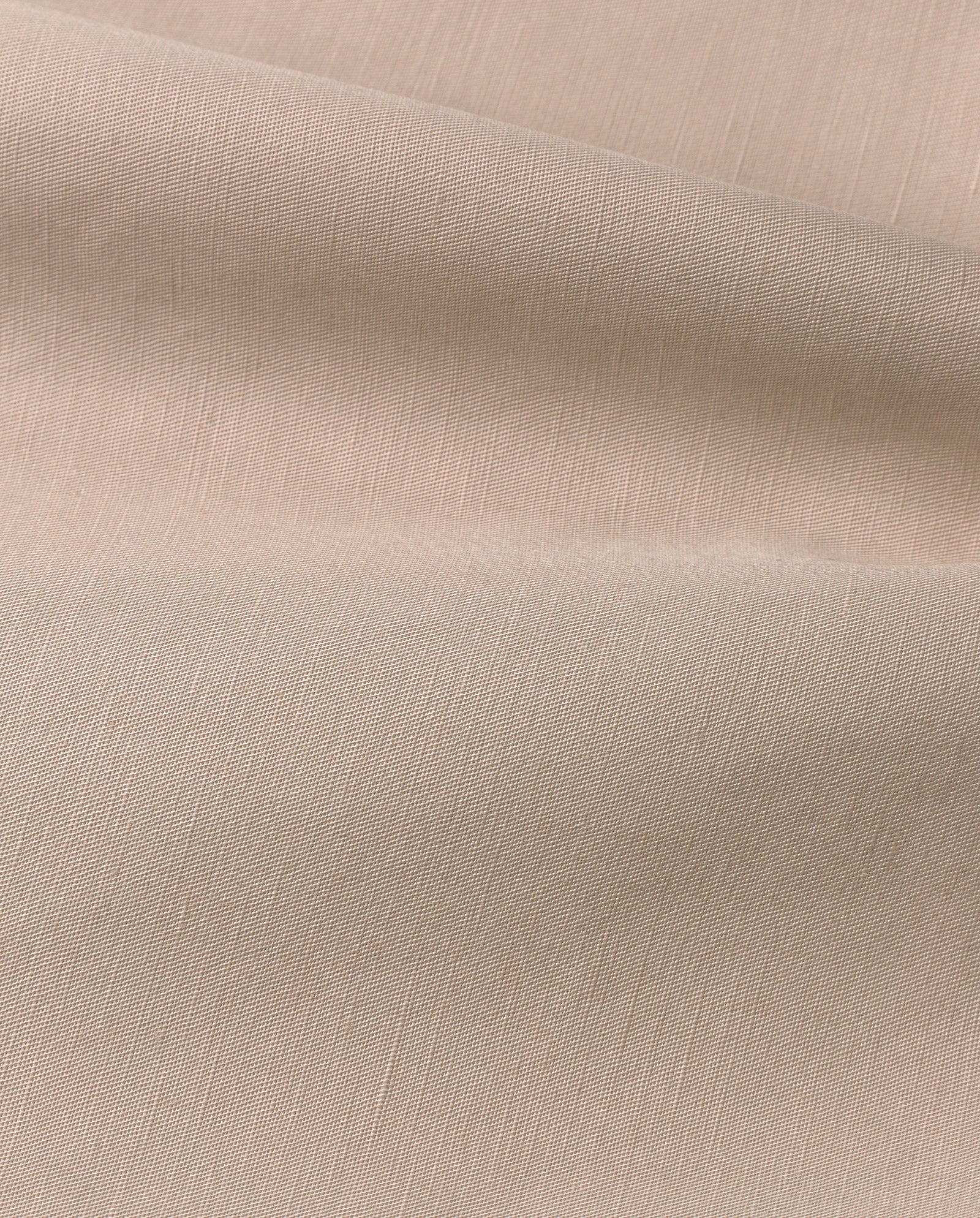Close-up of the NELA Dress by IVY OAK, featuring light beige linen blend fabric with visible texture and gentle folds.