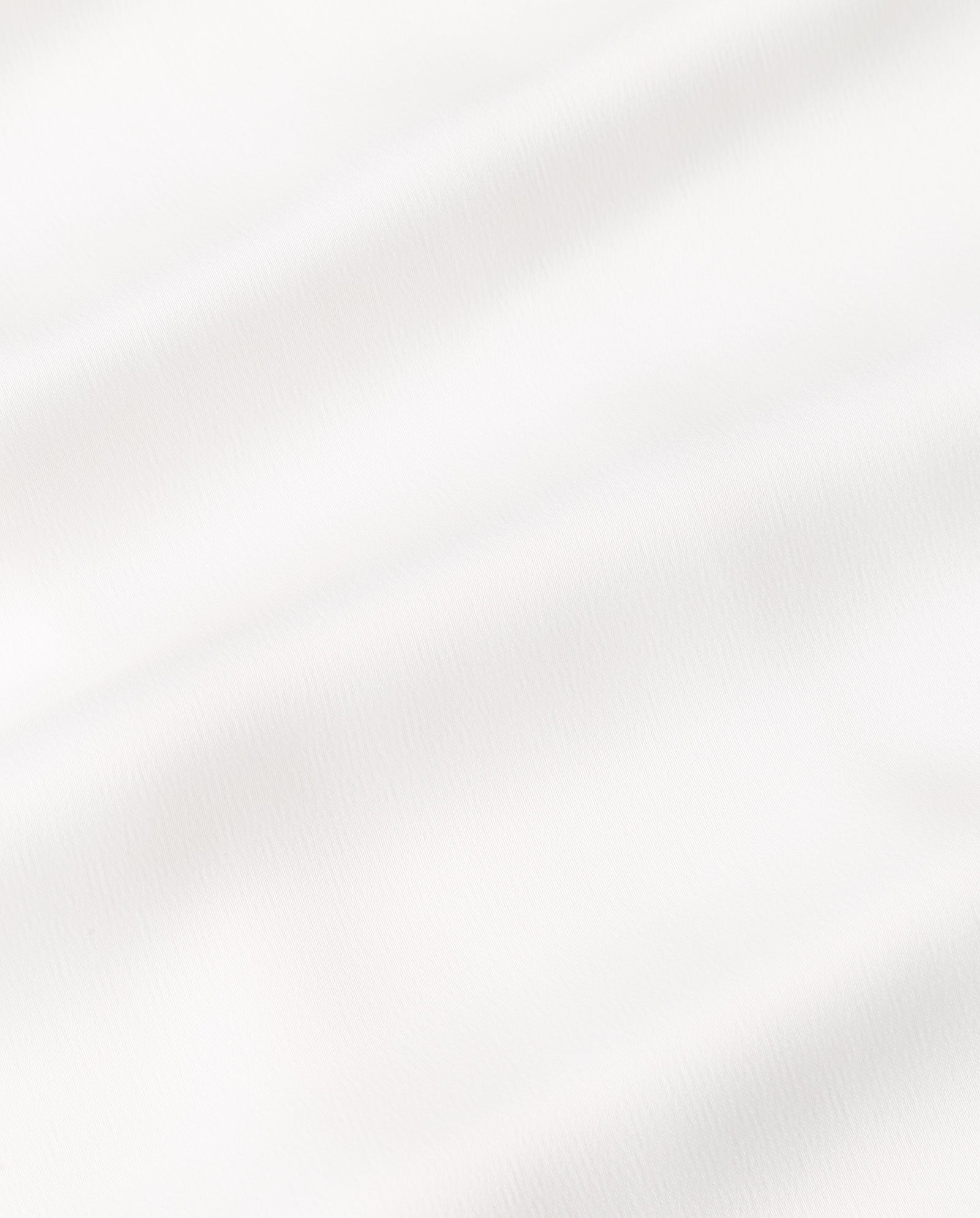 The DARCI ANN Dress by IVY OAK is a midi-length American shoulder dress crafted from white fabric with gentle wavy folds, a soft smooth texture, and features a discreet back zipper.