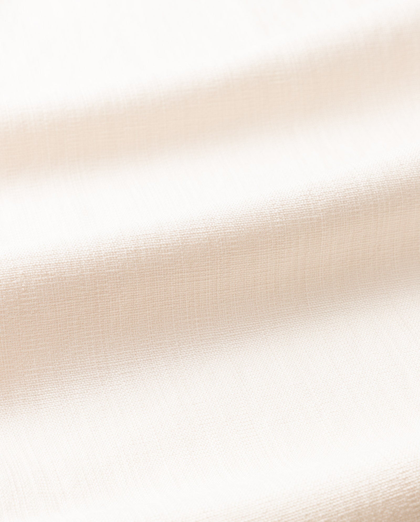 Close-up of light beige fabric from the IVY OAK JUNA Blazer, highlighting its soft texture and subtle horizontal folds.