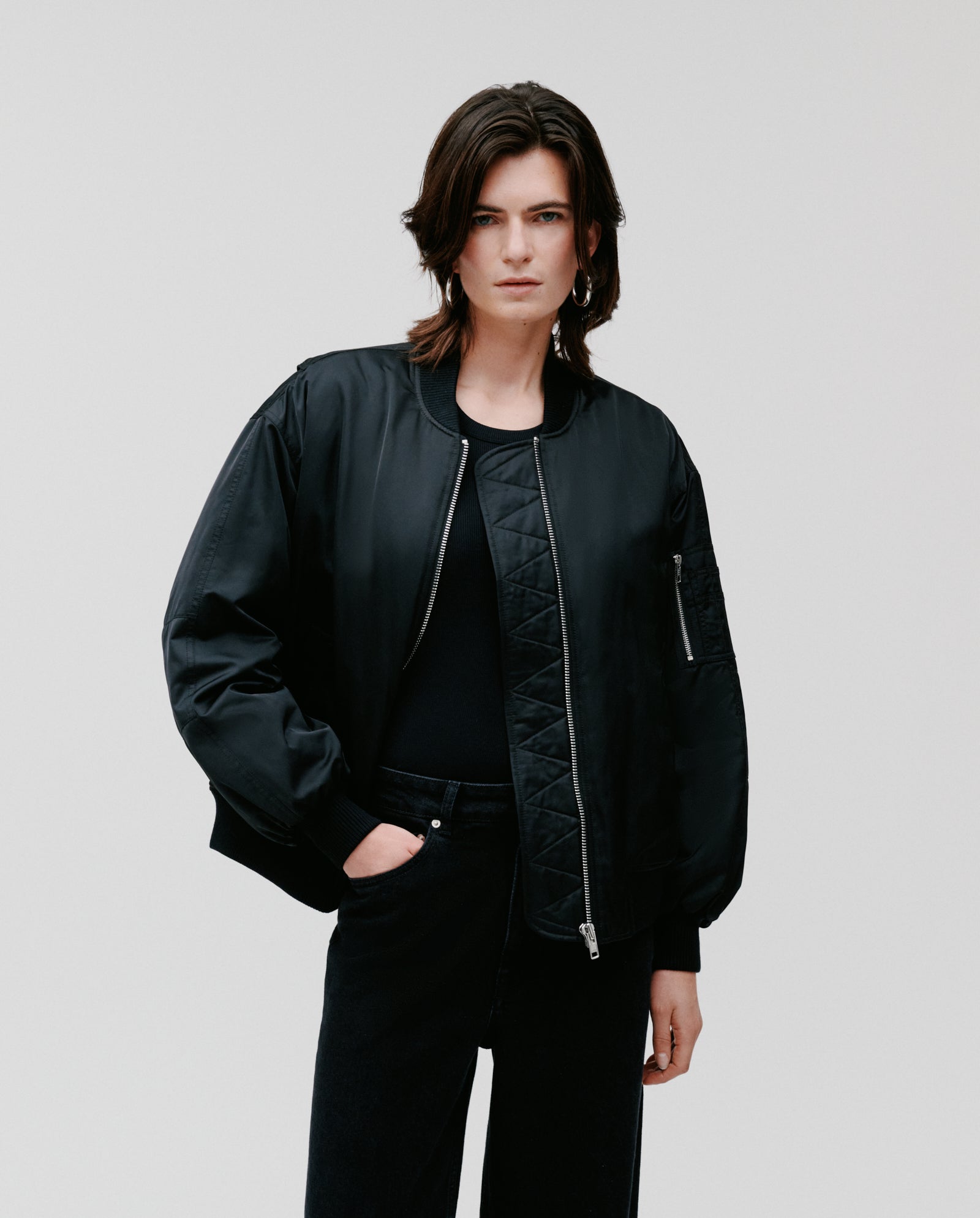 A person wearing the IVY OAK JANE Jacket and black pants stands against a plain white background.