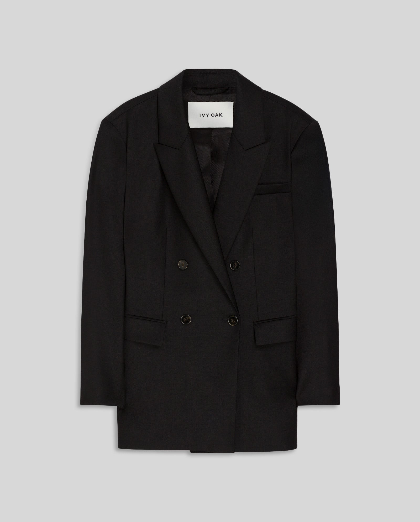 The JUDITH Blazer by IVY OAK is a black double-breasted wool-blend twill blazer with front pockets, shown on a plain gray background.