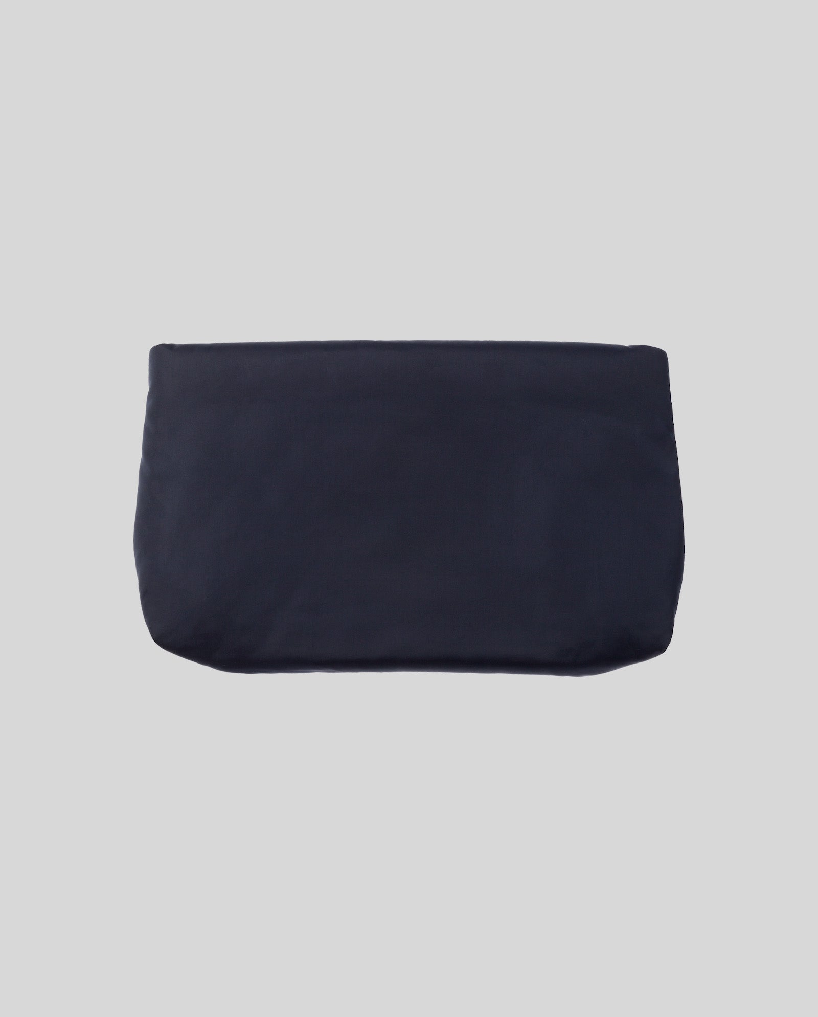 The IVY OAK AMINA ROSE Clutch is a plain, rectangular black padded clutch with a metal zip, shown on a light gray background.