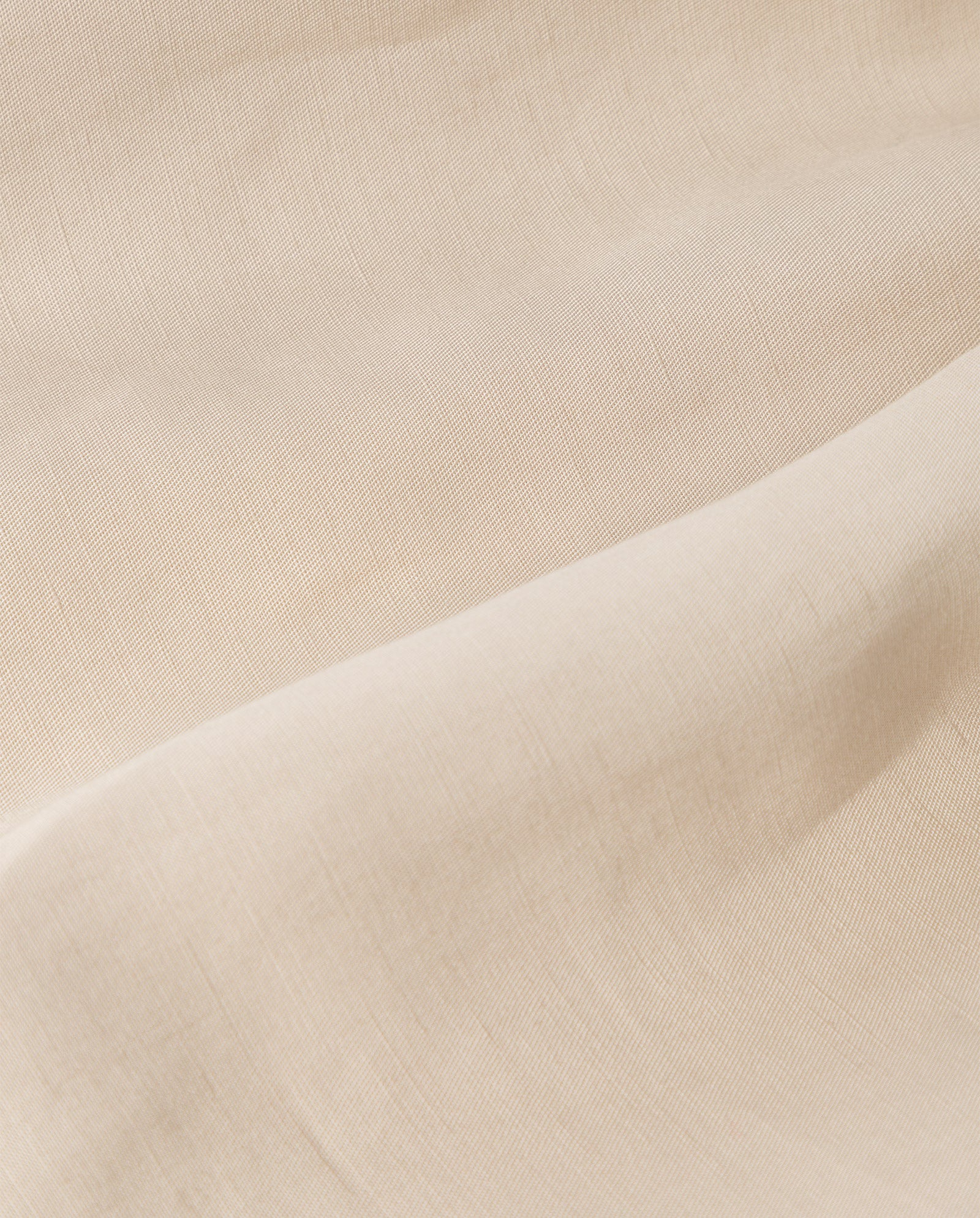Close-up of TAILOR SUE Top by IVY OAK in beige linen blend, showcasing its soft texture and gentle folds—ideal for an elegant American shoulder look.