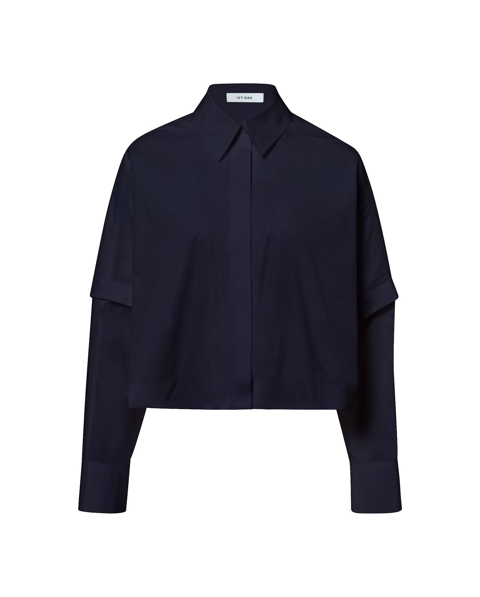 The ELVIRA Shirt by IVY OAK is a black, long-sleeve cropped blouse with a collar and button-up front, shown on a white background.