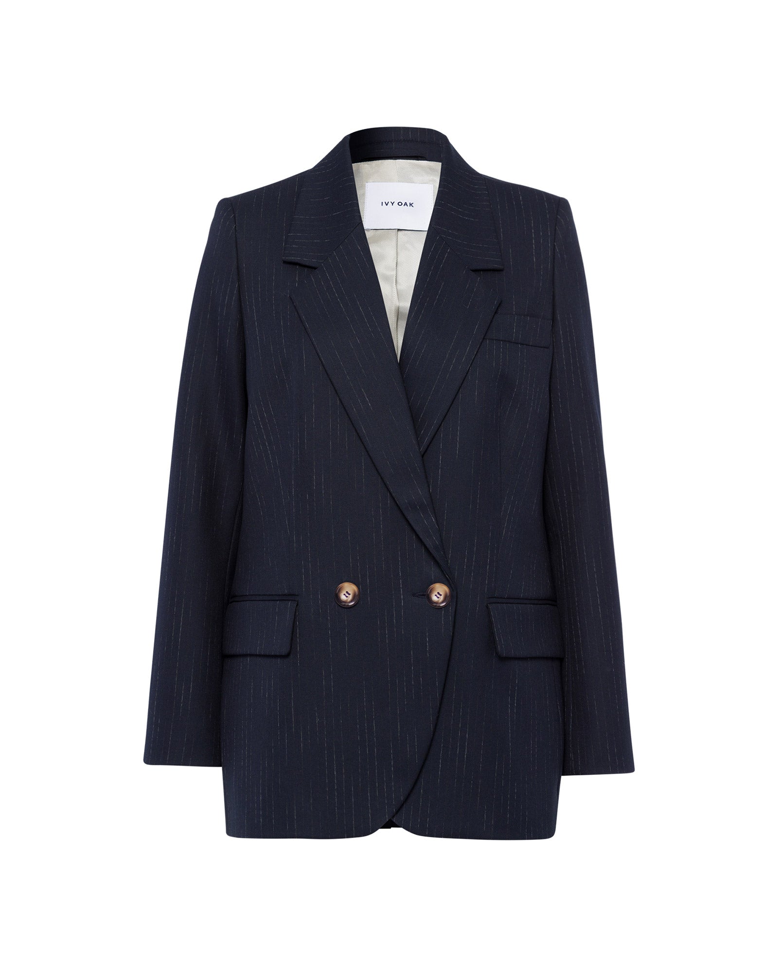 The JANINA ANN Blazer by IVY OAK is a navy pinstripe blazer with notched lapels, piped pockets, and two front buttons, made from recycled polyester and shown on a white background.