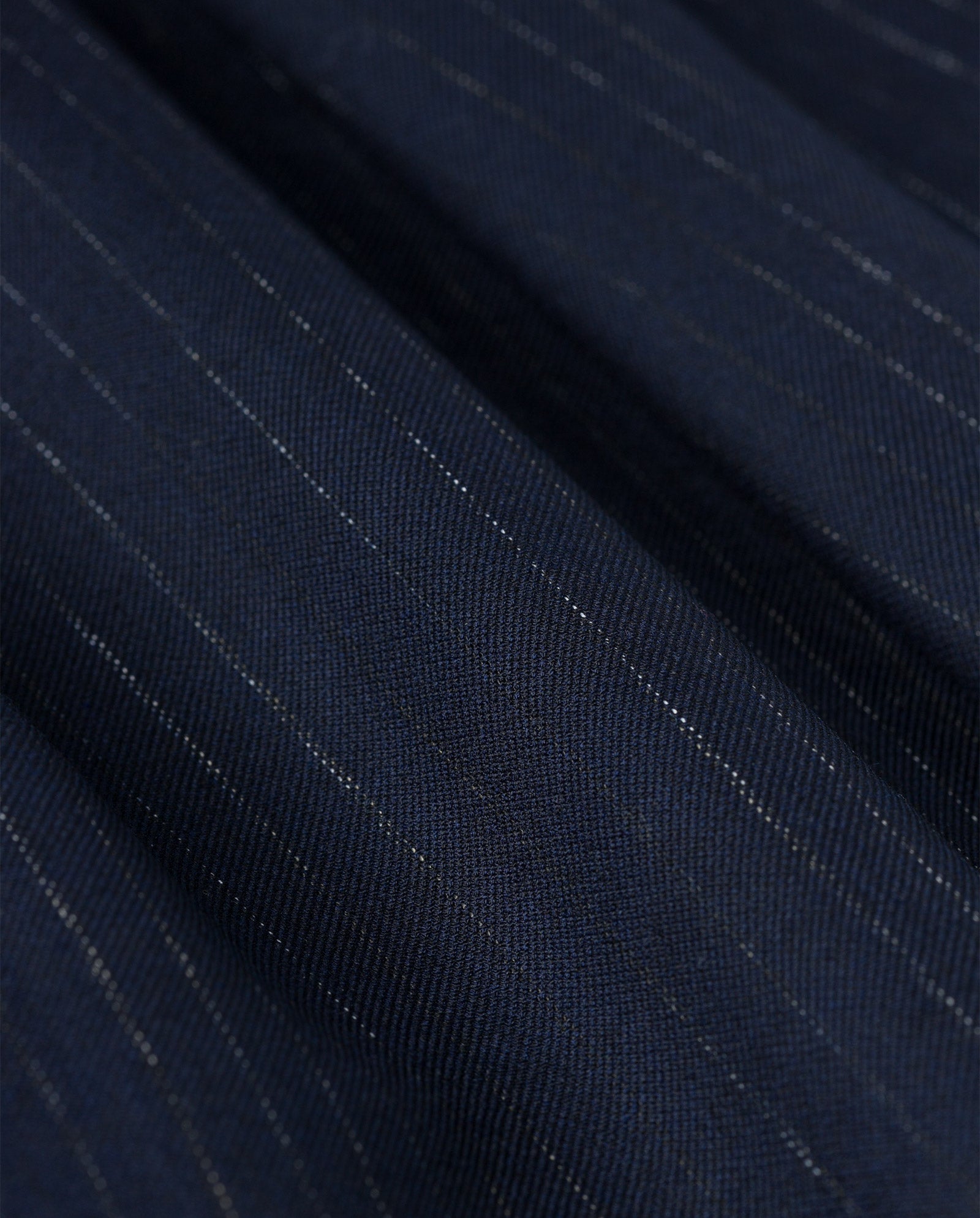 Close-up of the JANINA ANN Blazer by IVY OAK, crafted from dark blue recycled polyester fabric with subtle vertical pinstripes.